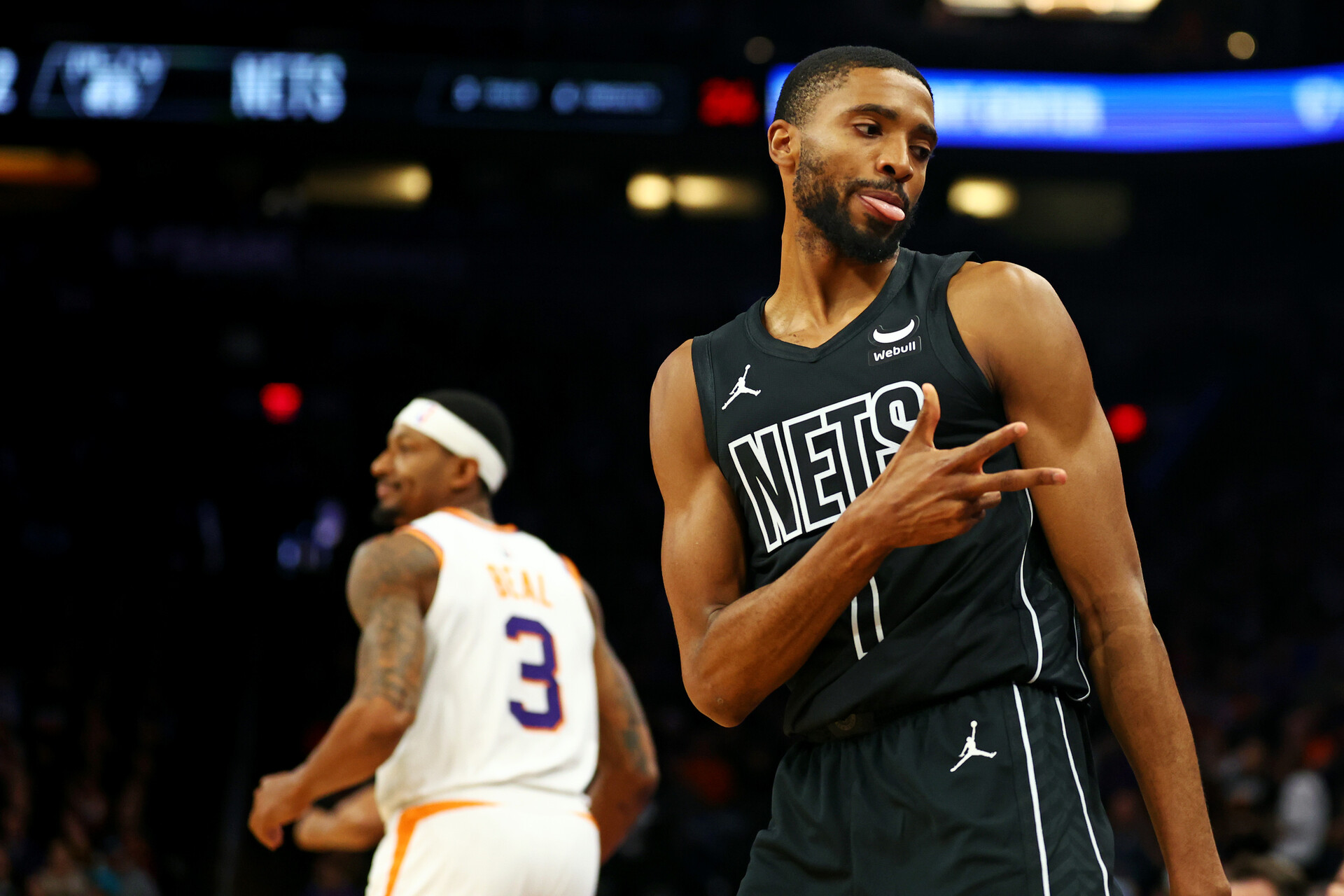 Dec 13, 2023; Phoenix, Arizona, USA; Brooklyn Nets forward Mikal Bridges (1) reacts after a play during the first quarter of the game against the Phoenix Suns at Footprint Center.
