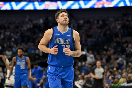 Dec 14, 2023; Dallas, Texas, USA; Dallas Mavericks guard Luka Doncic (77) runs back up the court after making a three point shot against the Minnesota Timberwolves during the first quarter at the American Airlines Center.