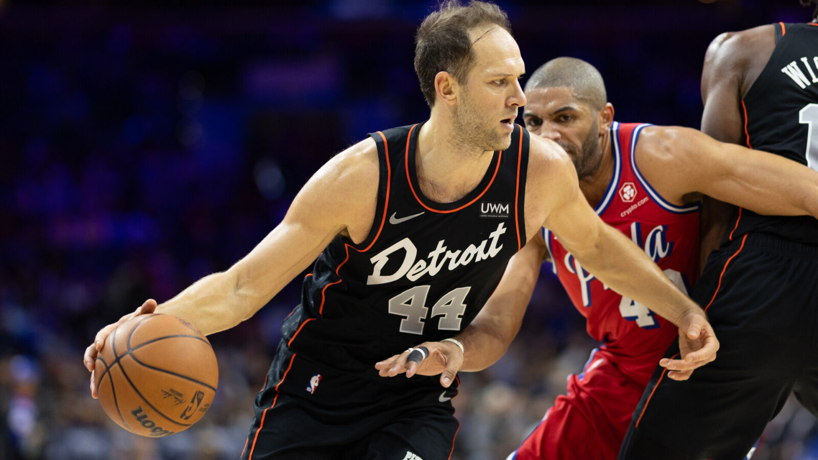 Detroit Pistons forward Bojan Bogdanovic (44) dribbles past Philadelphia 76ers forward Nicolas Batum (40) during the third quarter at Wells Fargo Center.