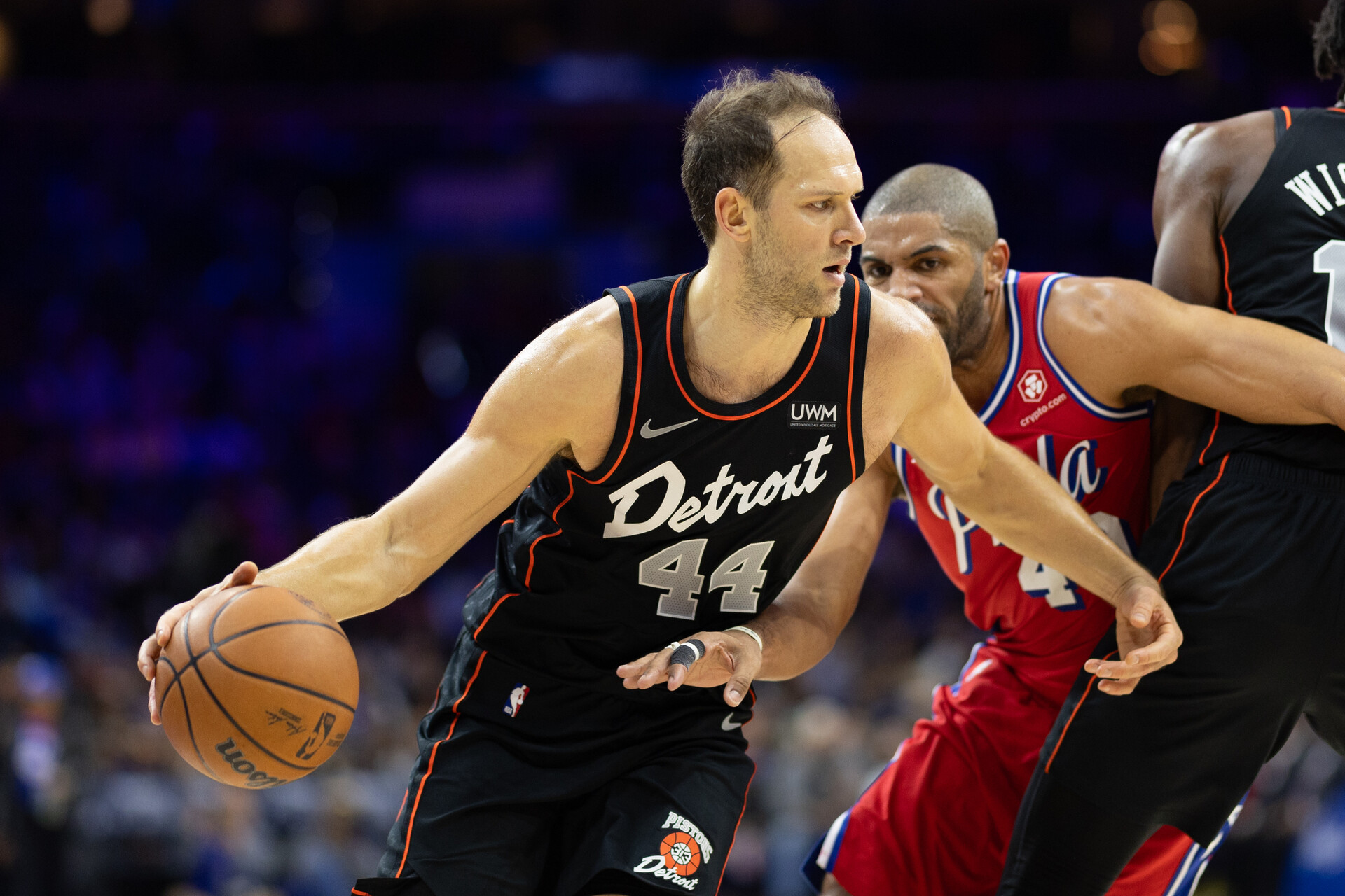 Detroit Pistons forward Bojan Bogdanovic (44) dribbles past Philadelphia 76ers forward Nicolas Batum (40) during the third quarter at Wells Fargo Center.
