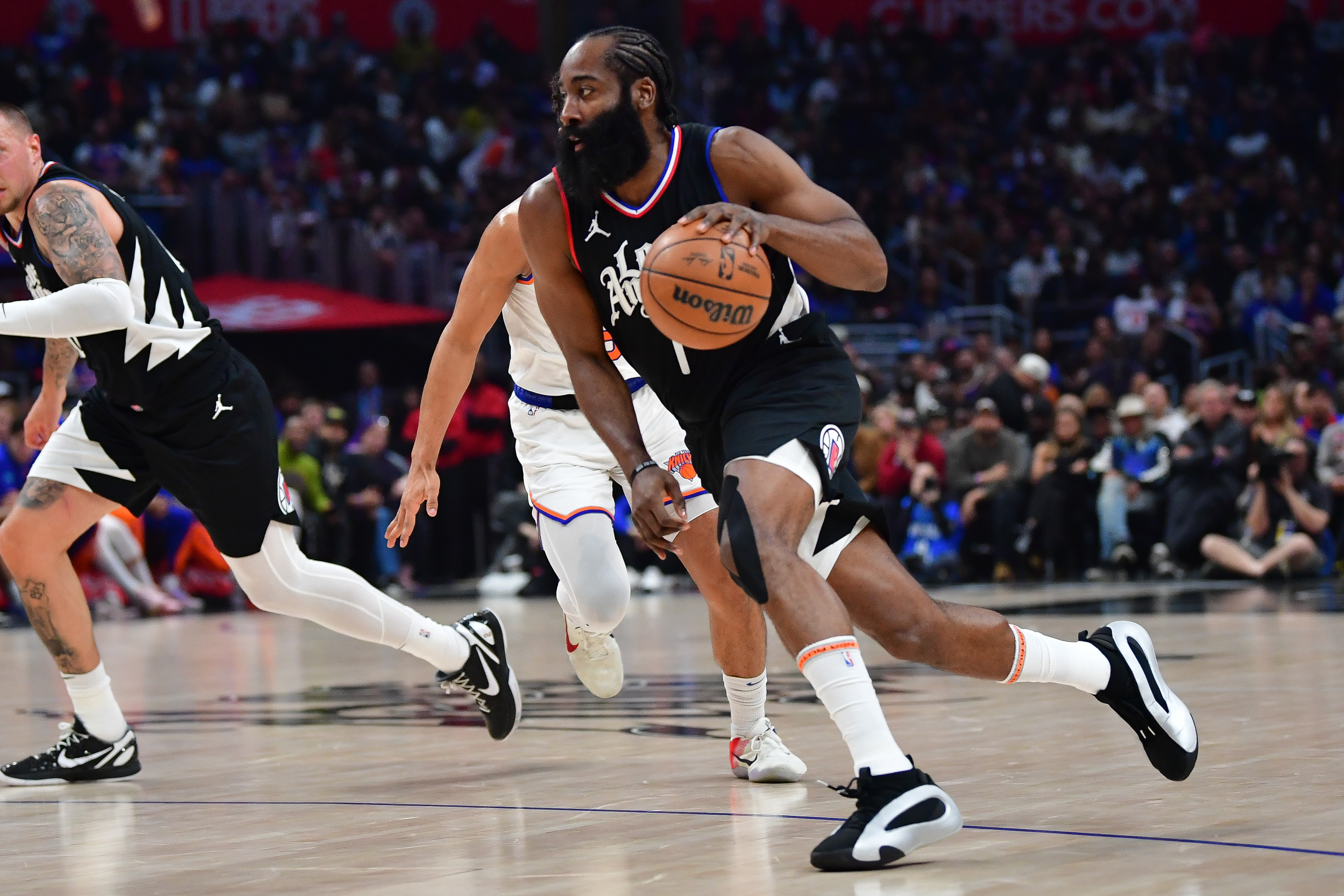 Dec 16, 2023; Los Angeles, California, USA; Los Angeles Clippers guard James Harden (1) moves to the basket against the New York Knicks during the first half at Crypto.com Aren