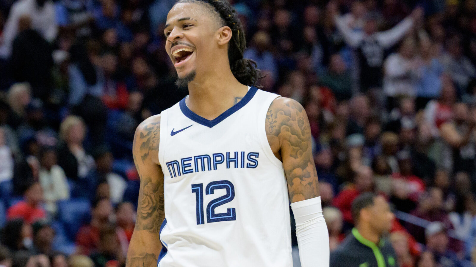 Dec 19, 2023; New Orleans, Louisiana, USA; Memphis Grizzlies guard Ja Morant (12) celebrates a score to even the game during the fourth quarter against the New Orleans Pelicans at the Smoothie King Center.