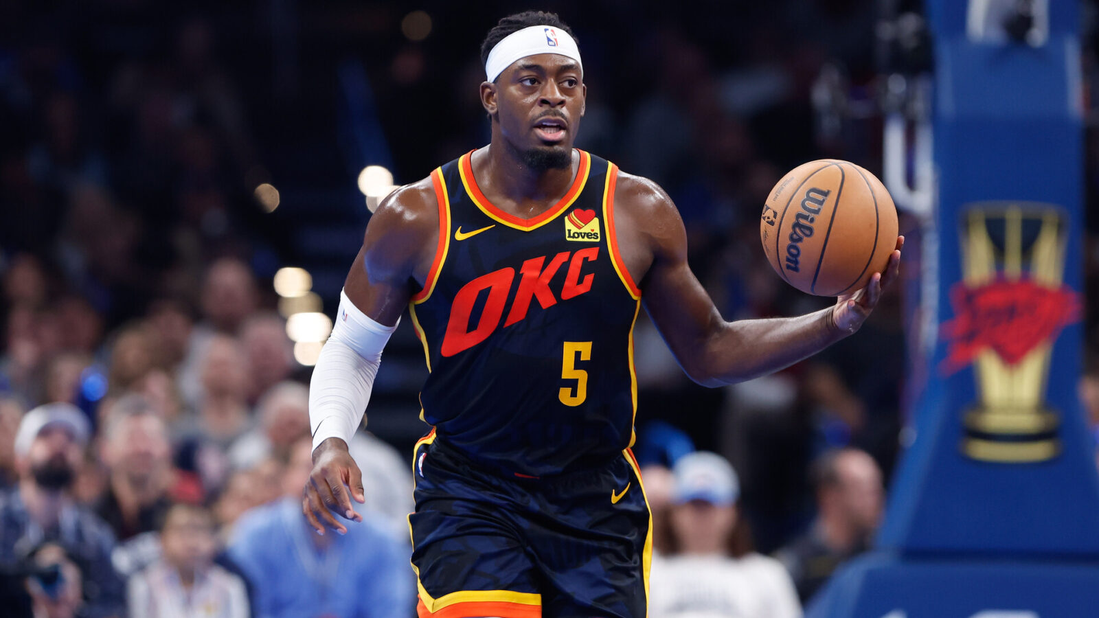 Oklahoma City Thunder guard Luguentz Dort (5) dribbles the ball down the court during the second half against the San Antonio Spurs at Paycom Center.