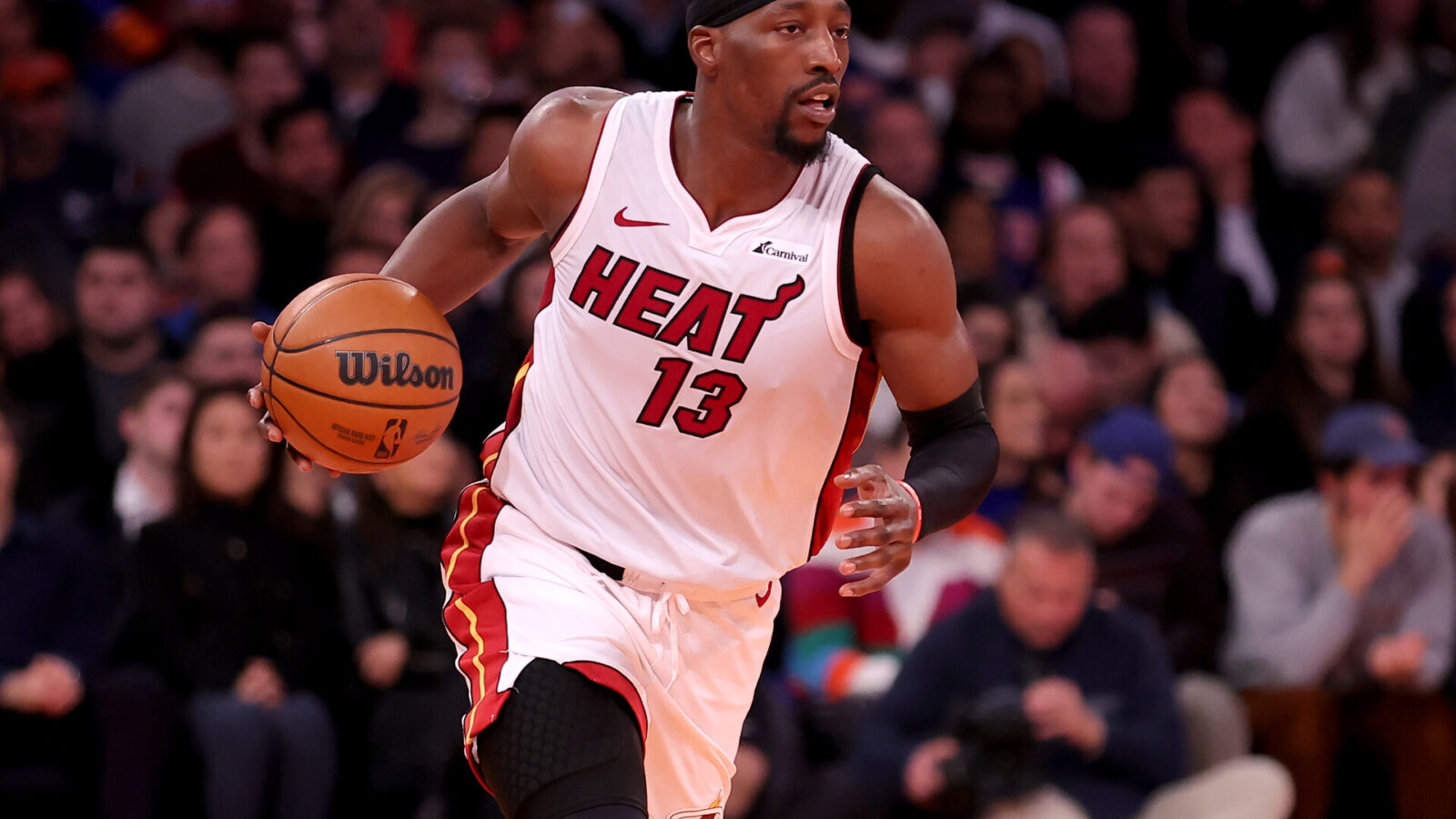 Miami Heat center Bam Adebayo (13) brings the ball up court against the New York Knicks during the first quarter at Madison Square Garden.