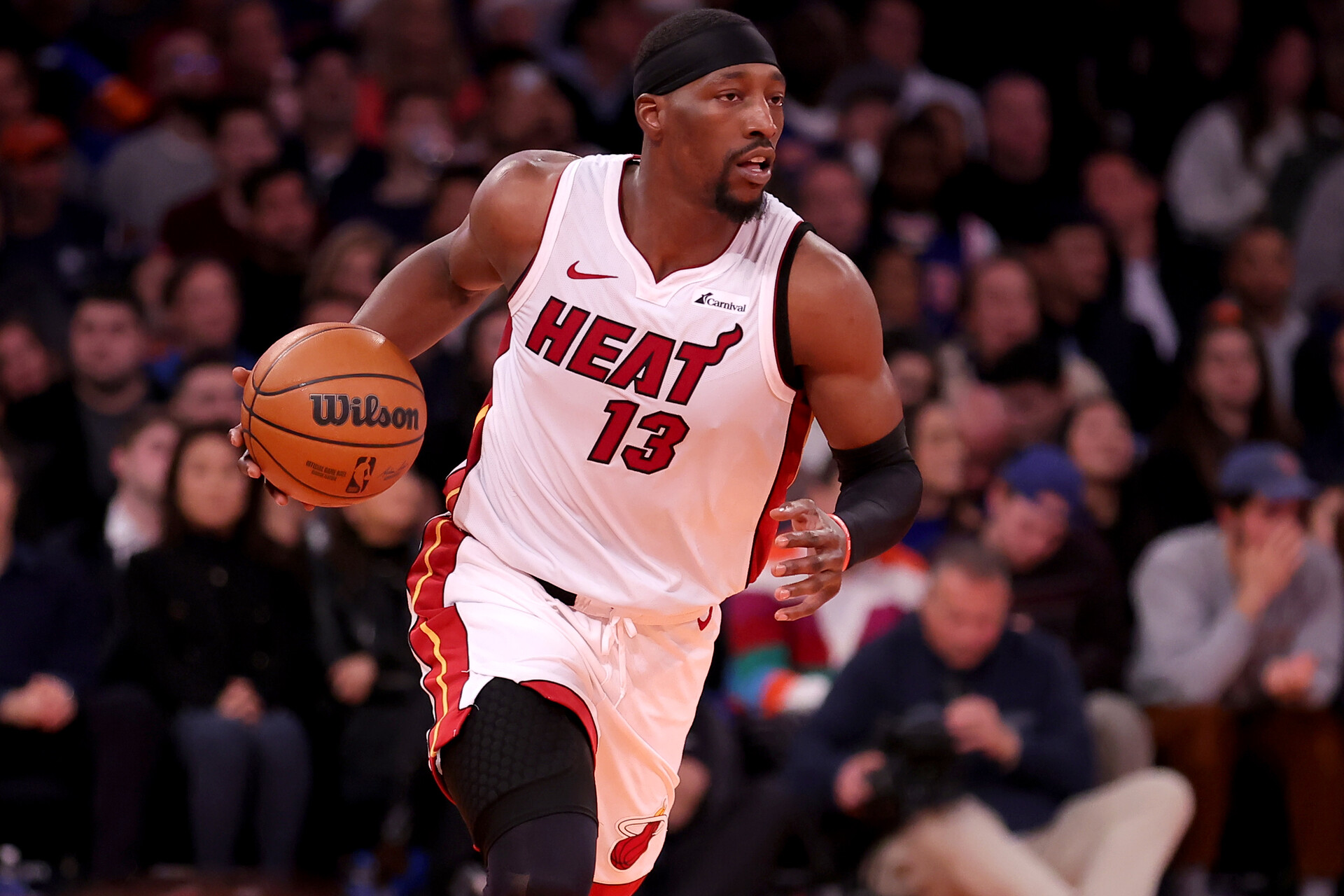 Miami Heat center Bam Adebayo (13) brings the ball up court against the New York Knicks during the first quarter at Madison Square Garden.