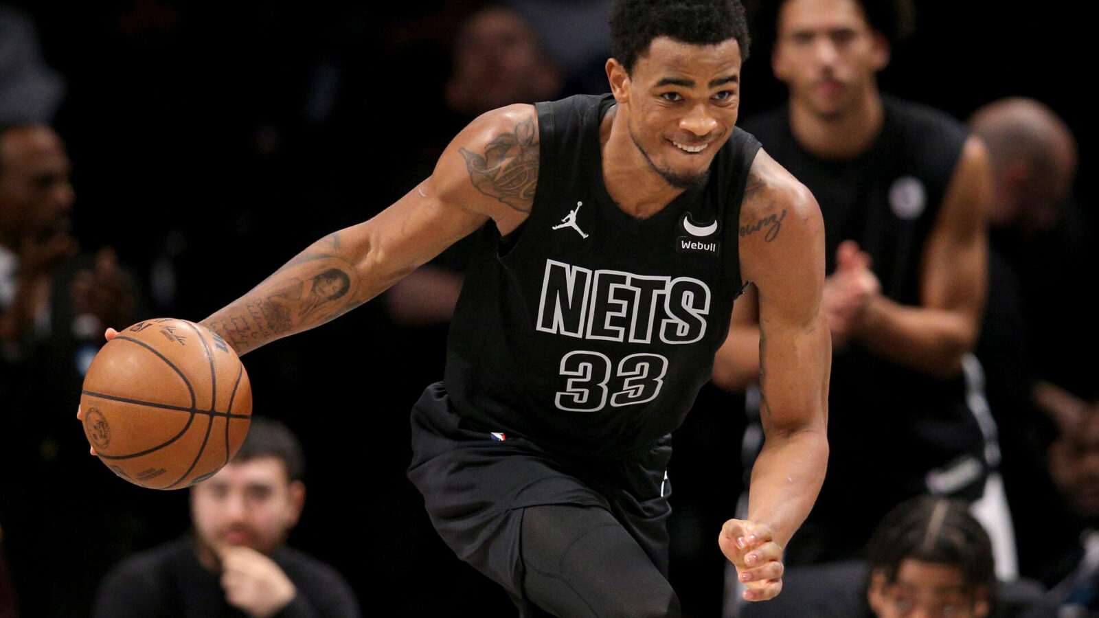 Brooklyn Nets center Nic Claxton (33) brings the ball up court against the Denver Nuggets during the fourth quarter at Barclays Center.