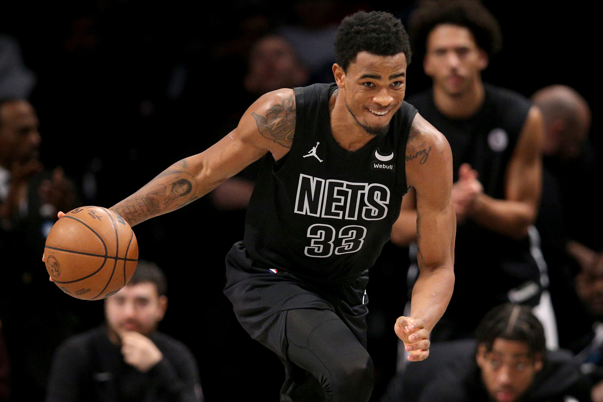 Brooklyn Nets center Nic Claxton (33) brings the ball up court against the Denver Nuggets during the fourth quarter at Barclays Center.