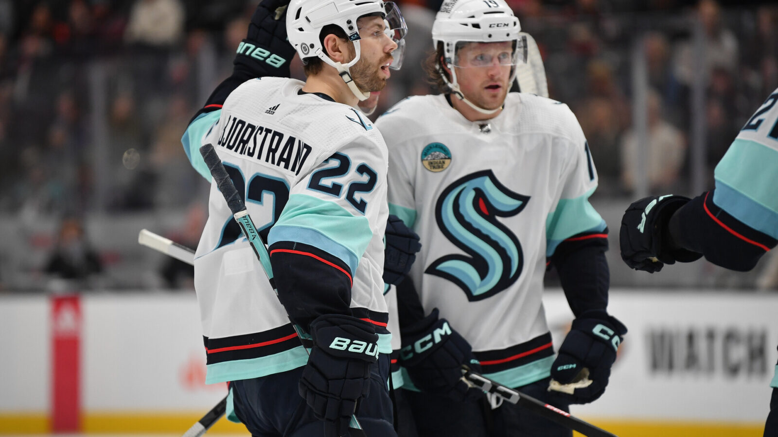 Dec 23, 2023; Anaheim, California, USA; Seattle Kraken right wing Oliver Bjorkstrand (22) celebrates his goal scored against the Anaheim Ducks with left wing Jared McCann (19) during the first period at Honda Center.