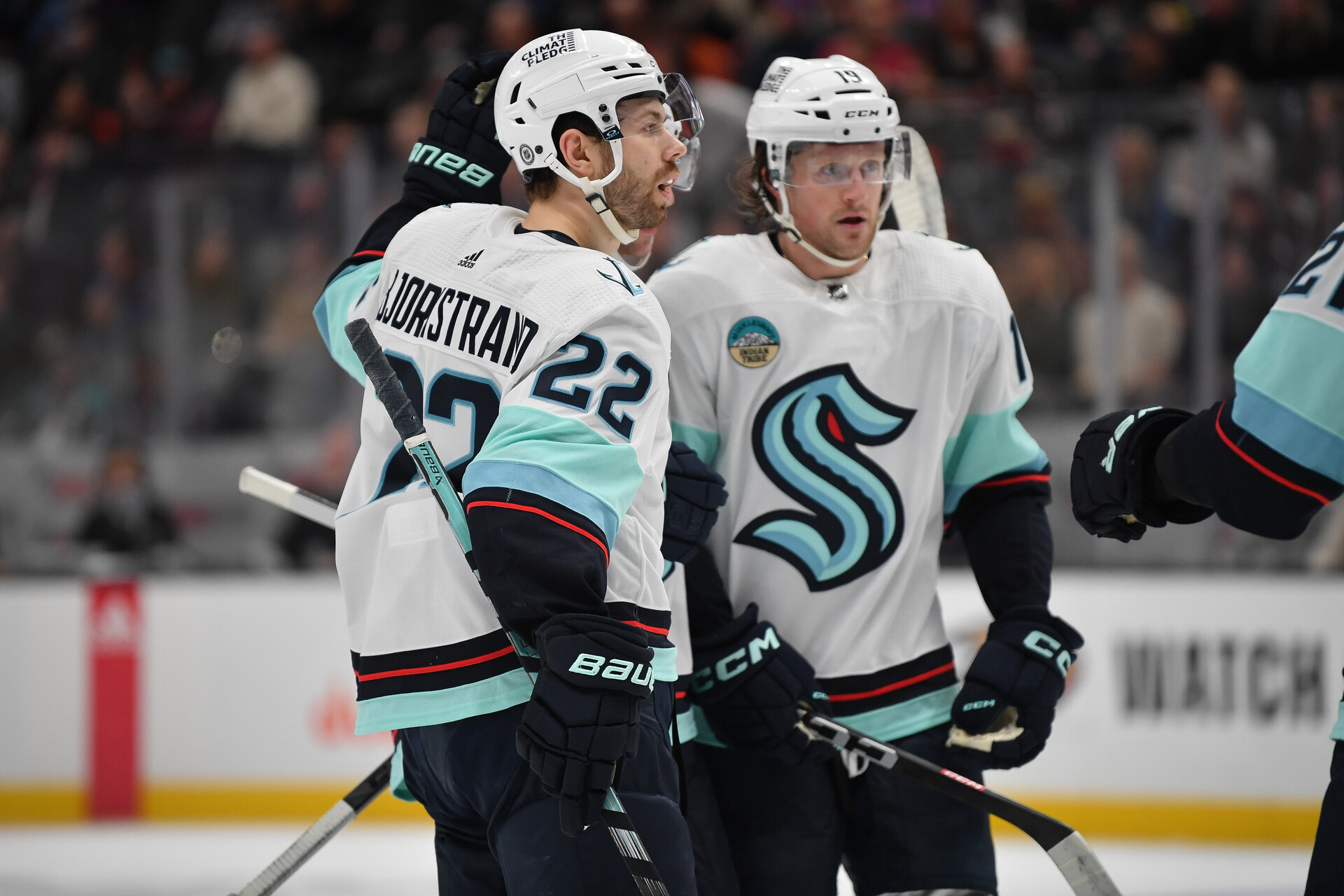 Dec 23, 2023; Anaheim, California, USA; Seattle Kraken right wing Oliver Bjorkstrand (22) celebrates his goal scored against the Anaheim Ducks with left wing Jared McCann (19) during the first period at Honda Center.