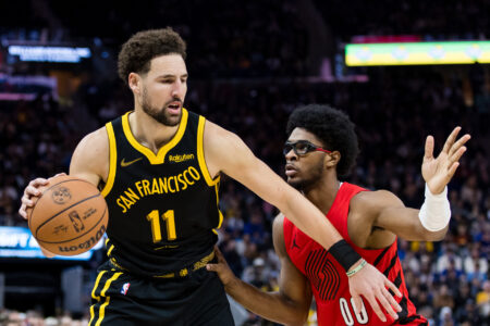 Portland Trail Blazers guard Scoot Henderson (00) defends Golden State Warriors forward Klay Thompson (11) during the second half at Chase Center.