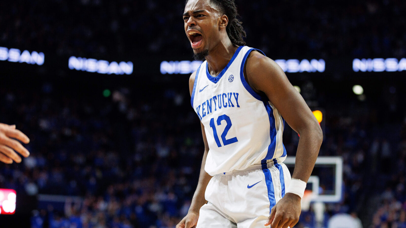 Kentucky Wildcats guard Antonio Reeves (12) celebrates after dunking the ball during the second half against the Illinois State Redbirds at Rupp Arena at Central Bank Center.