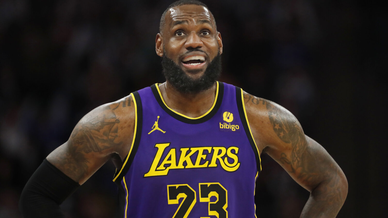 Los Angeles Lakers forward LeBron James (23) looks to the replay board as he awaits play to resume against the Minnesota Timberwolves in the third quarter at Target Center.