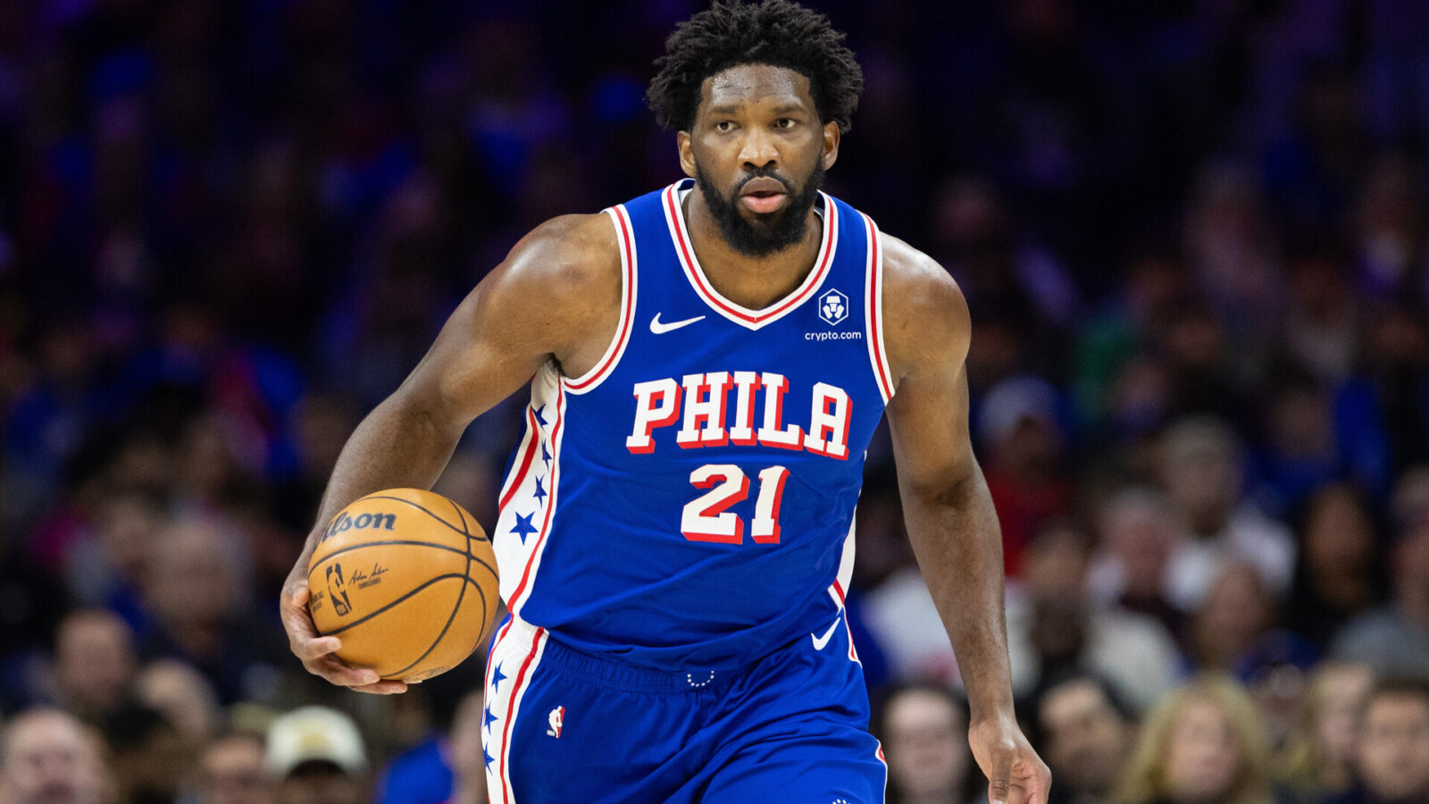 Philadelphia 76ers center Joel Embiid (21) dribbles up court against the Chicago Bulls during the first quarter at Wells Fargo Center.