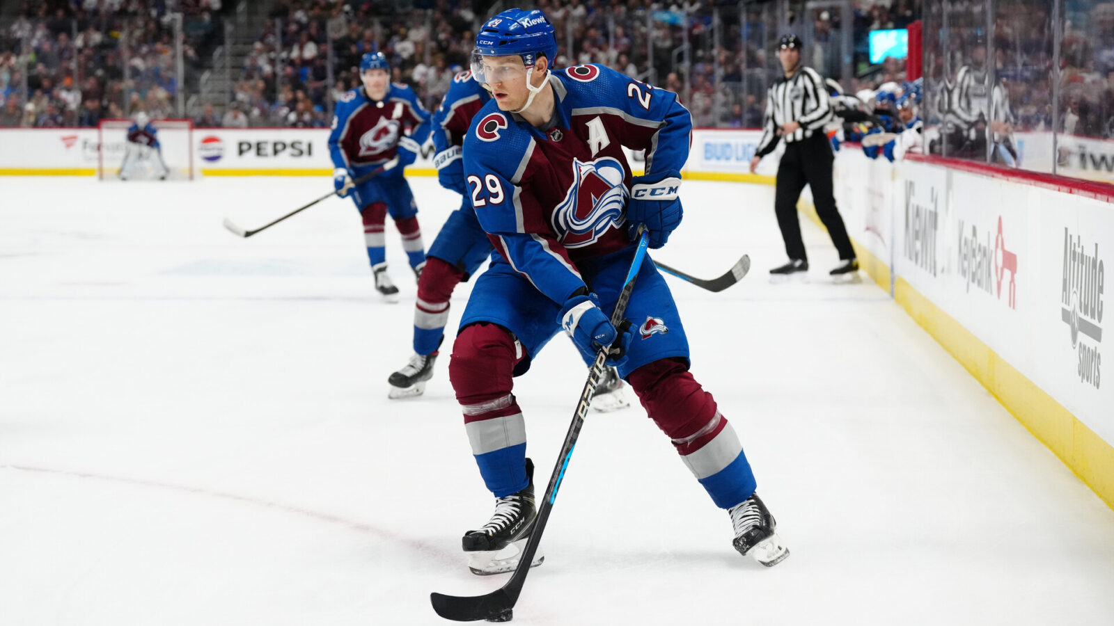 Jan 2, 2024; Denver, Colorado, USA; Colorado Avalanche center Nathan MacKinnon (29) controls the puck in overtime against the New York Islanders at Ball Arena.