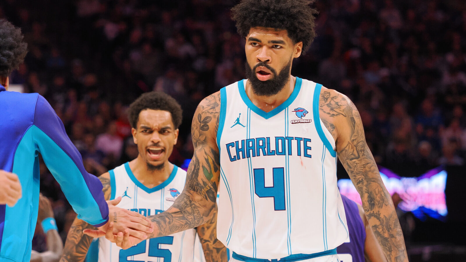 Charlotte Hornets center Nick Richards (4) celebrates with his teammates at a time out against the Sacramento Kings during the fourth quarter at Golden 1 Center.