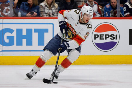 Jan 6, 2024; Denver, Colorado, USA; Florida Panthers center Carter Verhaeghe (23) controls the puck in the second period against the Colorado Avalanche at Ball Arena.