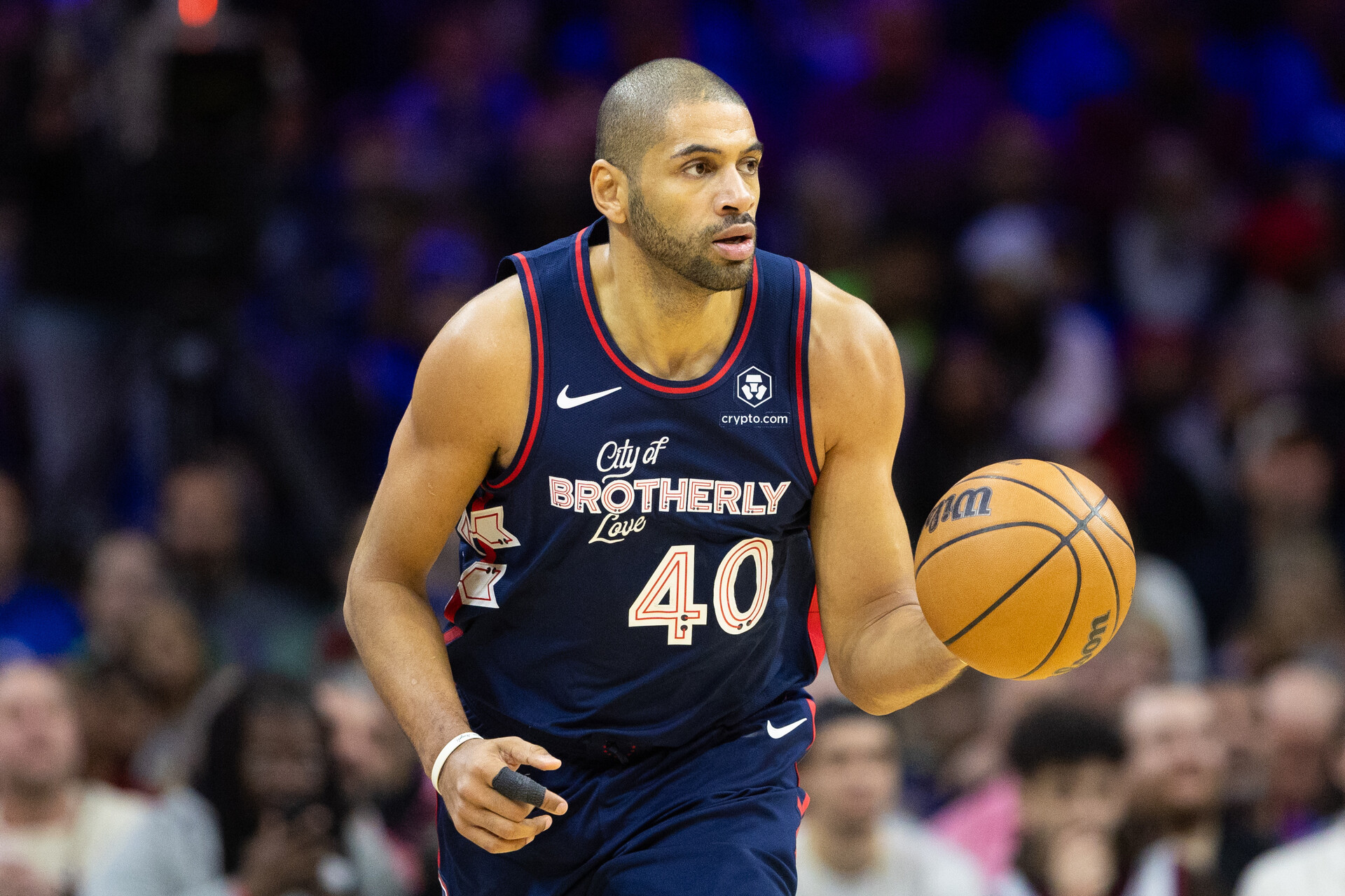 Jan 6, 2024; Philadelphia, Pennsylvania, USA; Philadelphia 76ers forward Nicolas Batum (40) dribbles up court against the Utah Jazz during the first quarter at Wells Fargo Center.