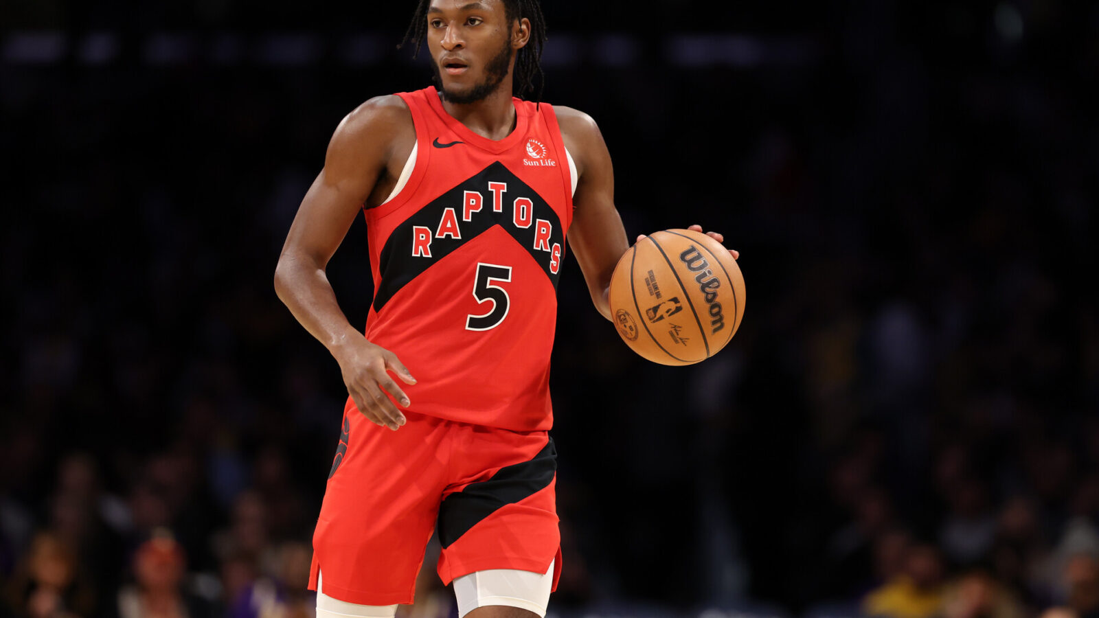 Toronto Raptors guard Immanuel Quickley (5) dribbles the ball during the third quarter against the Los Angeles Lakers at Crypto.com Arena.