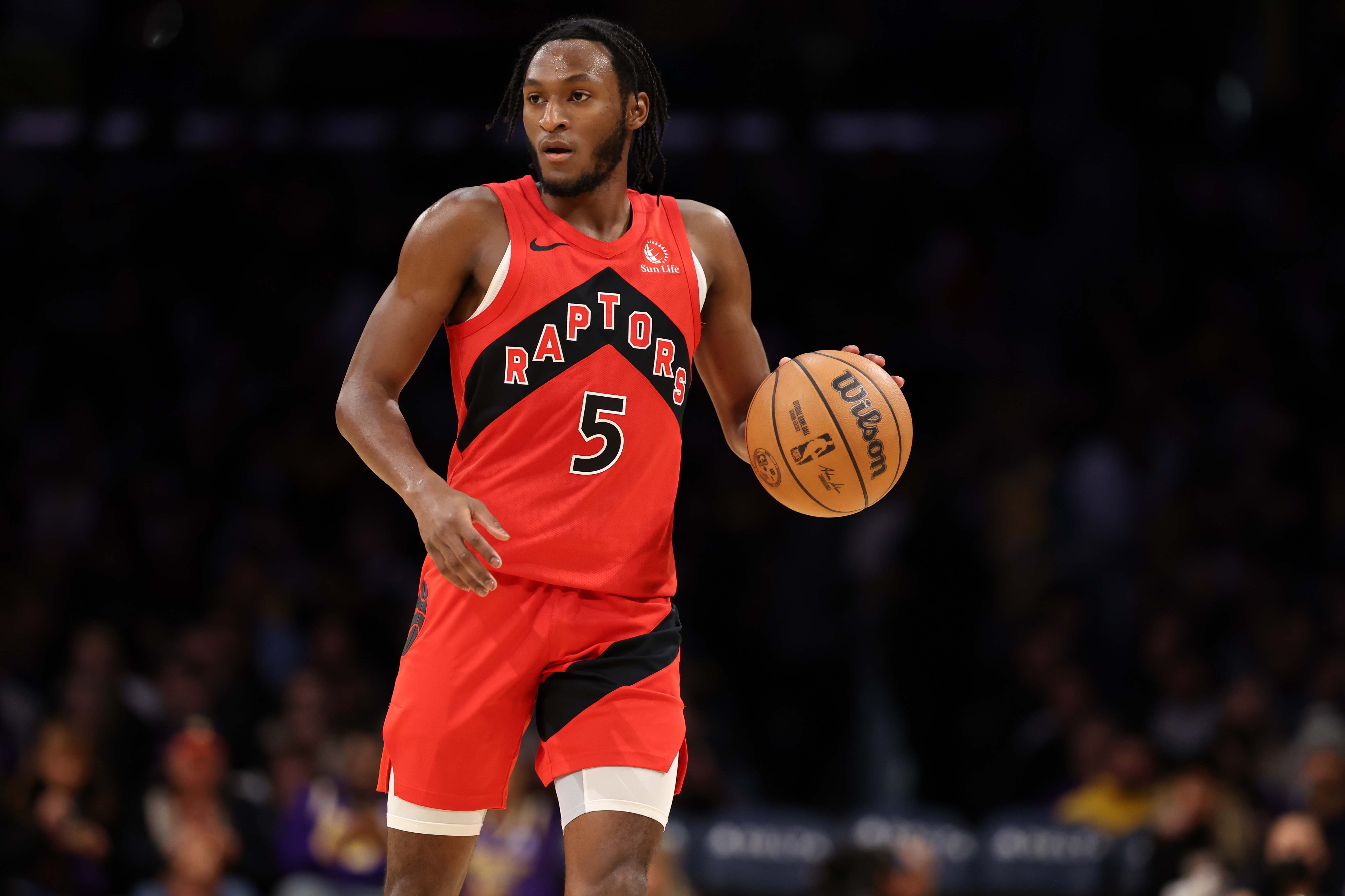 Toronto Raptors guard Immanuel Quickley (5) dribbles the ball during the third quarter against the Los Angeles Lakers at Crypto.com Arena.