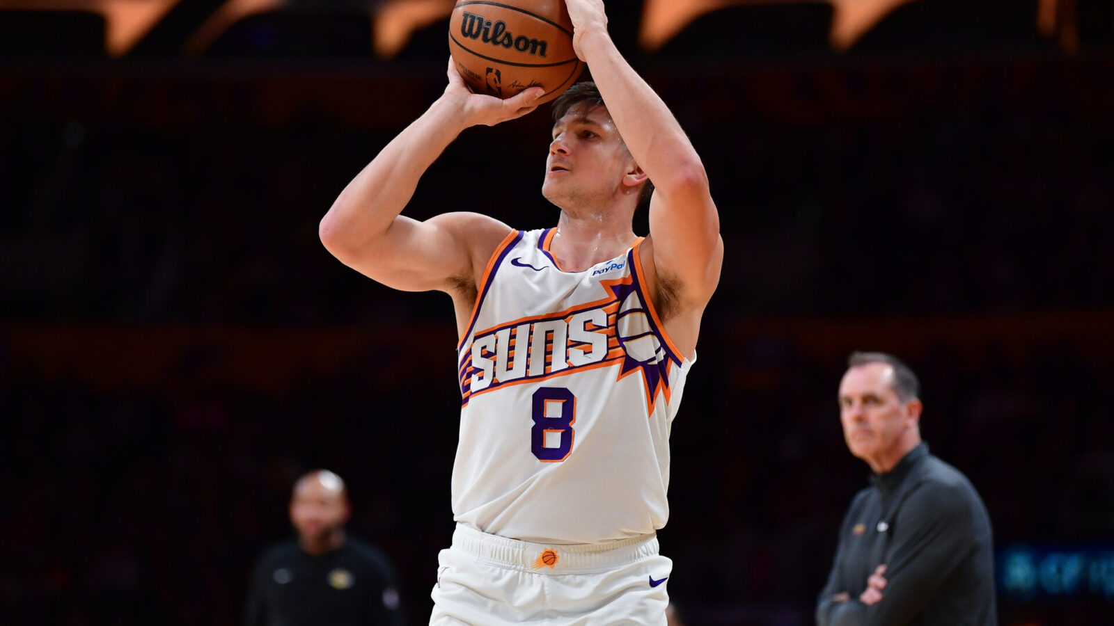 Jan 11, 2024; Los Angeles, California, USA; Phoenix Suns guard Grayson Allen (8) shoots against the Los Angeles Lakers during the first half at Crypto.com Arena