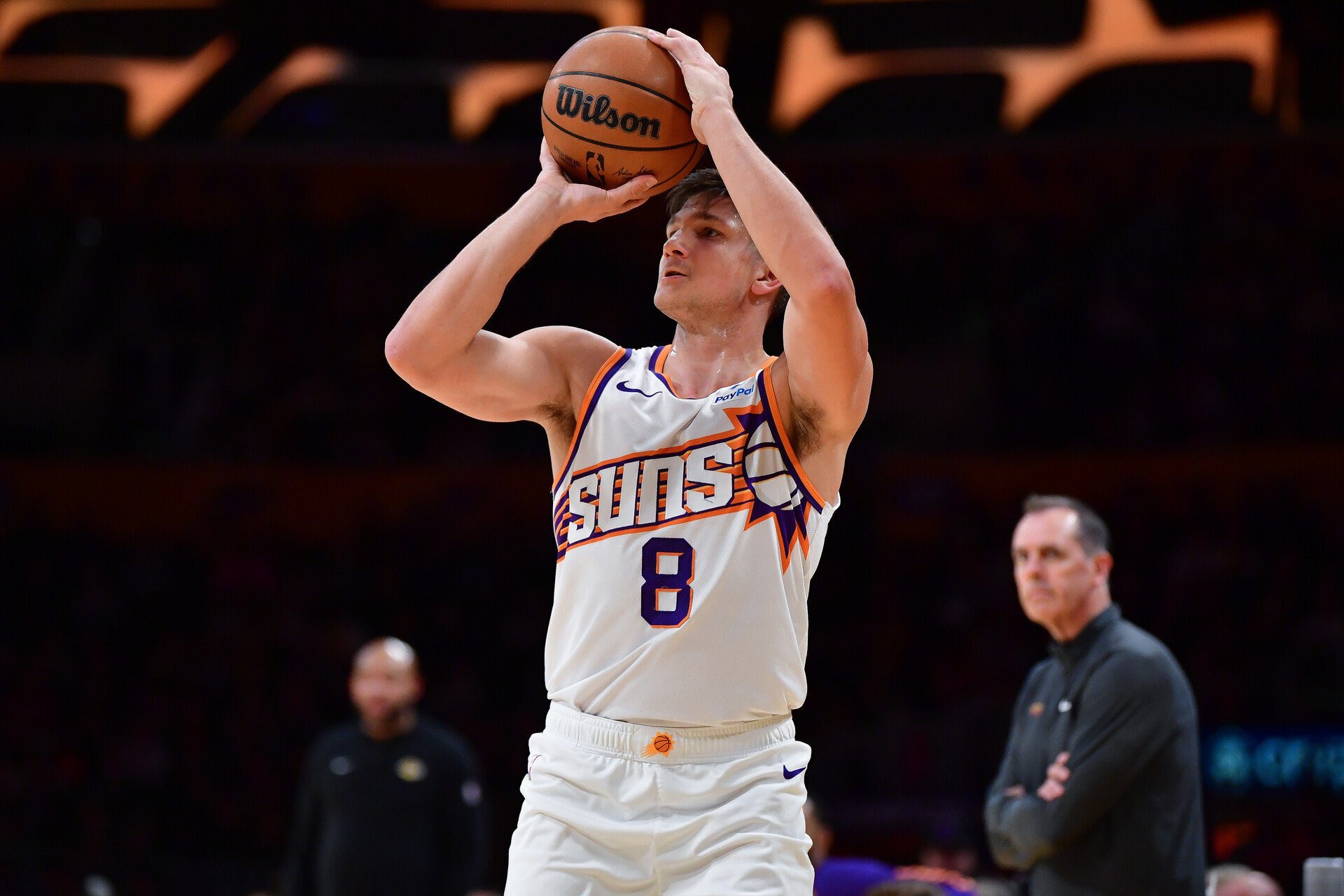 Jan 11, 2024; Los Angeles, California, USA; Phoenix Suns guard Grayson Allen (8) shoots against the Los Angeles Lakers during the first half at Crypto.com Arena