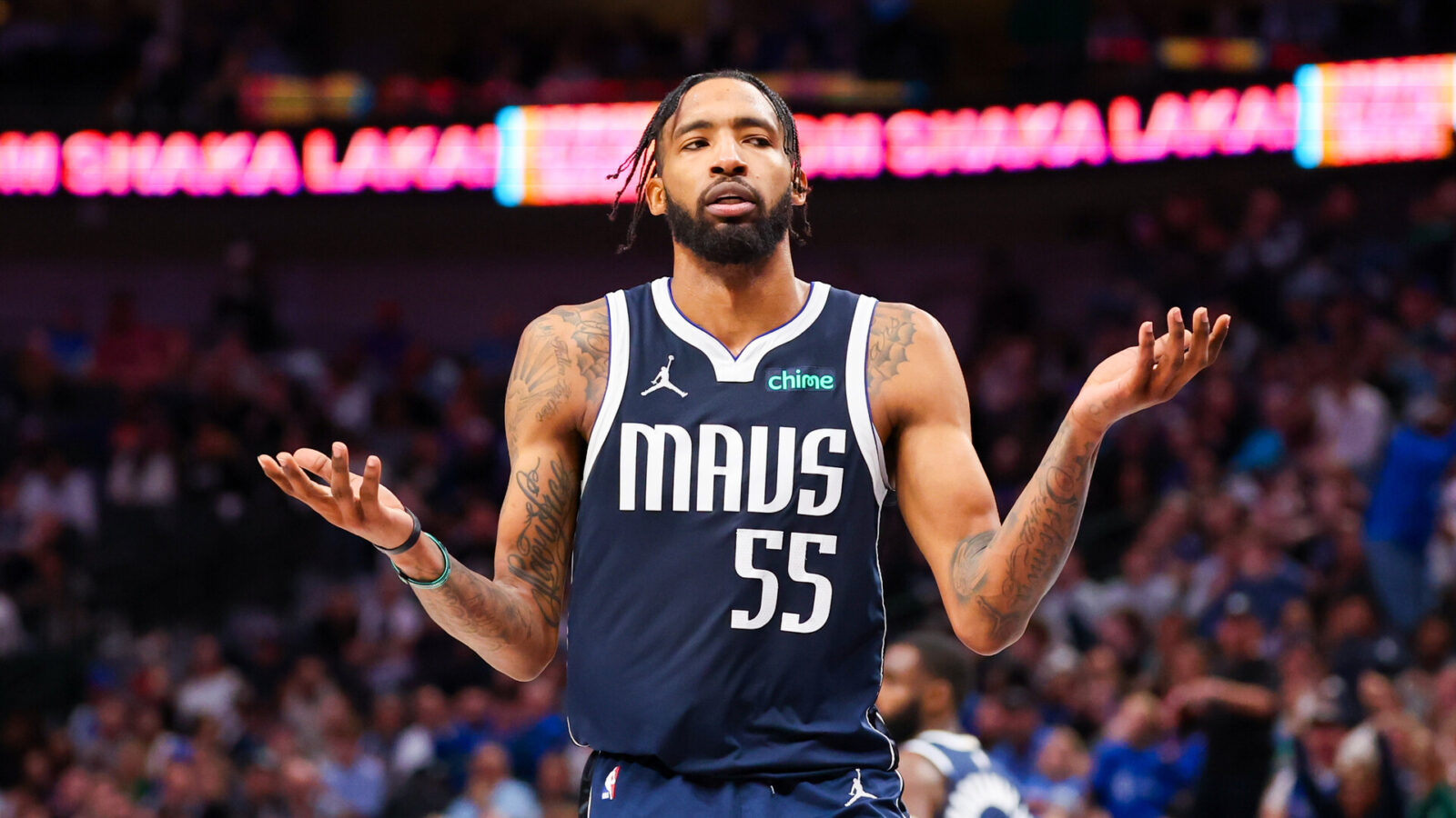 Jan 11, 2024; Dallas, Texas, USA; Dallas Mavericks forward Derrick Jones Jr. (55) reacts after dunking during the second half against the New York Knicks at American Airlines Center.