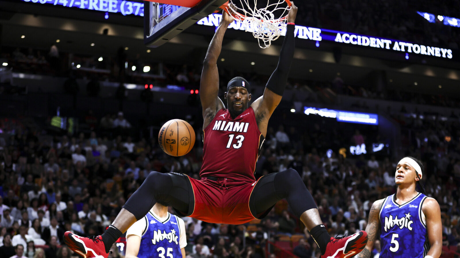 Jan 12, 2024; Miami, Florida, USA; Miami Heat center Bam Adebayo (13) dunks the basketball against the Orlando Magic during the second quarter at Kaseya Center.