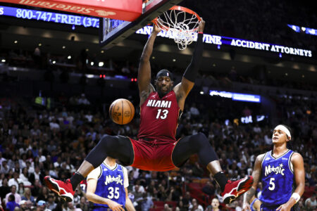Jan 12, 2024; Miami, Florida, USA; Miami Heat center Bam Adebayo (13) dunks the basketball against the Orlando Magic during the second quarter at Kaseya Center.