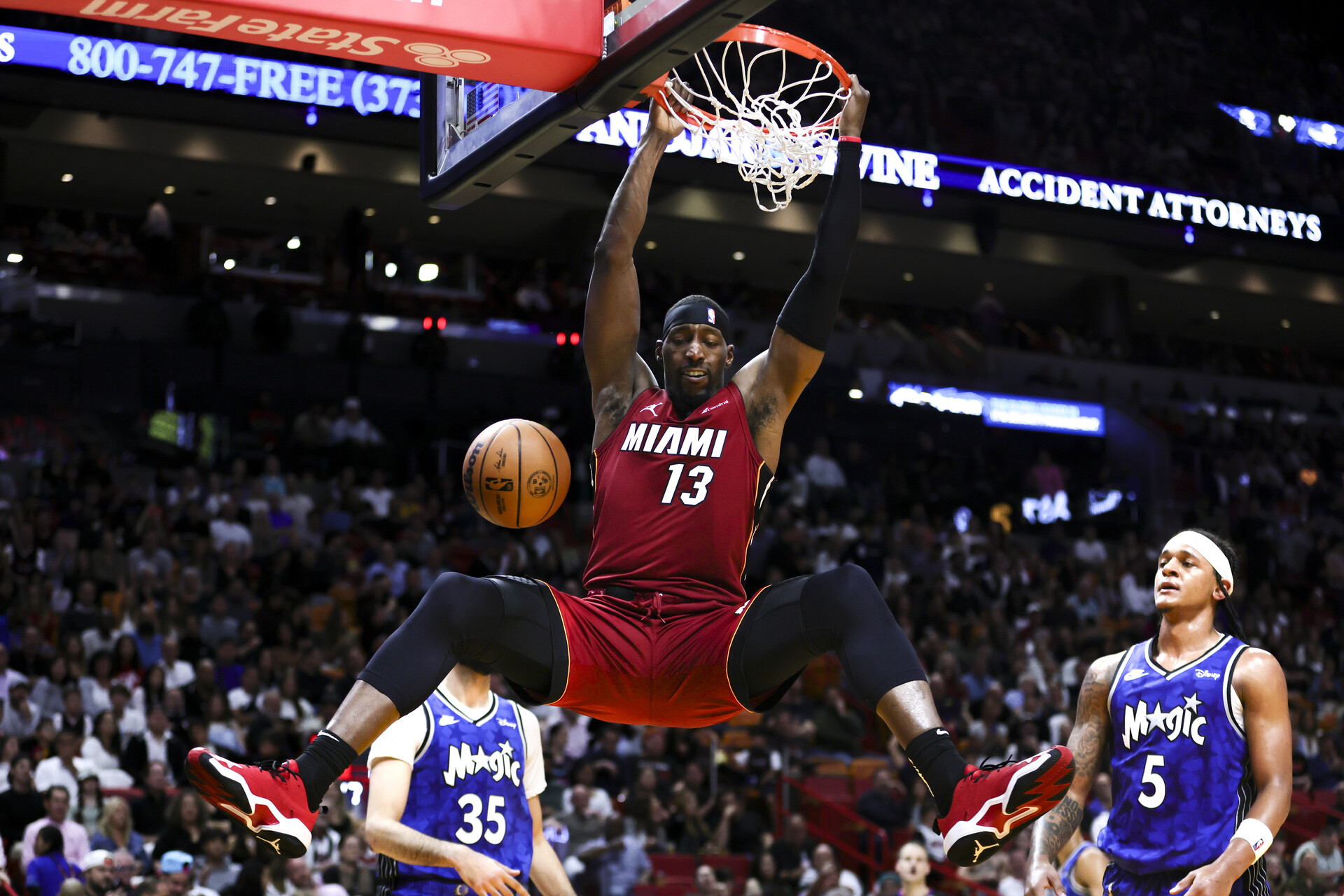 Jan 12, 2024; Miami, Florida, USA; Miami Heat center Bam Adebayo (13) dunks the basketball against the Orlando Magic during the second quarter at Kaseya Center.