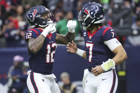 Jan 13, 2024; Houston, Texas, USA; Houston Texans wide receiver Nico Collins (12) celebrates with quarterback C.J. Stroud (7) after a touchdown in a 2024 AFC wild card game against the Cleveland Browns at NRG Stadium.