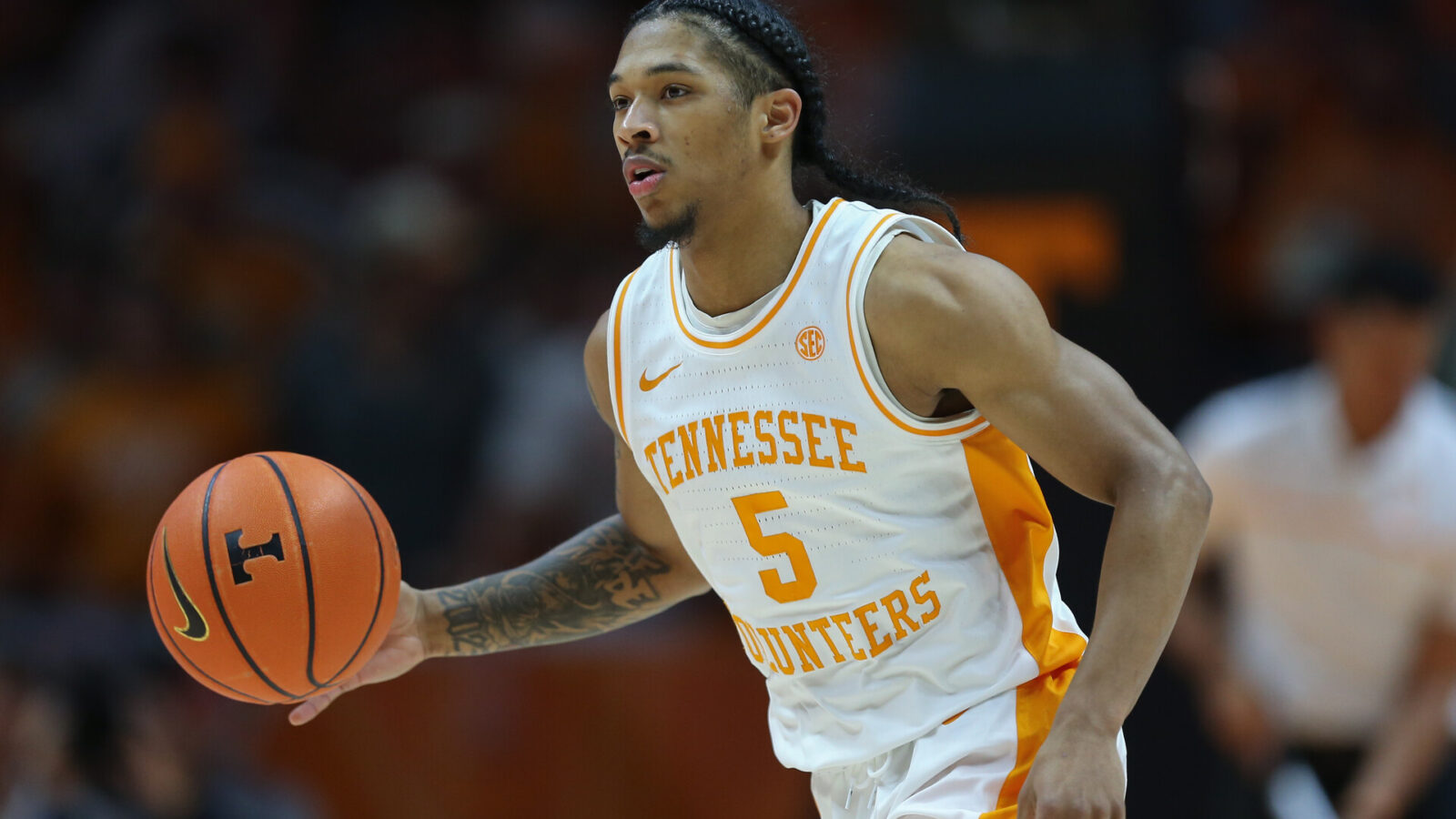Tennessee Volunteers guard Zakai Zeigler (5) dribbles the ball against the Florida Gators during the second half at Thompson-Boling Arena at Food City Center.