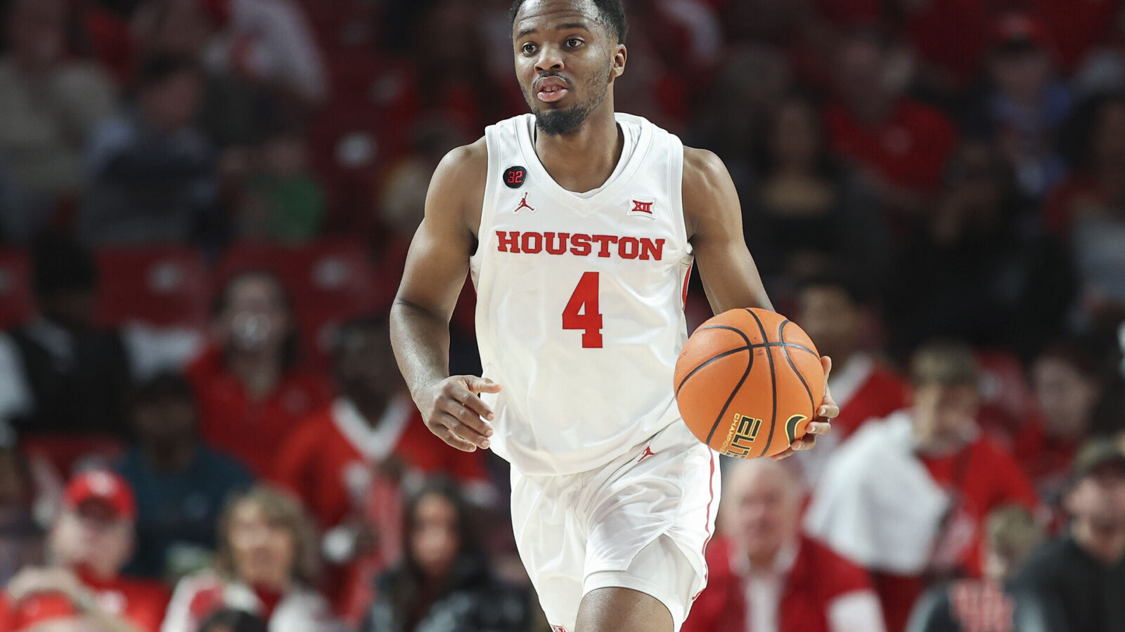 Houston Cougars guard L.J. Cryer (4) brings the ball up the court during the first half against the UCF Knights at Fertitta Center.