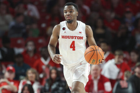 Houston Cougars guard L.J. Cryer (4) brings the ball up the court during the first half against the UCF Knights at Fertitta Center.