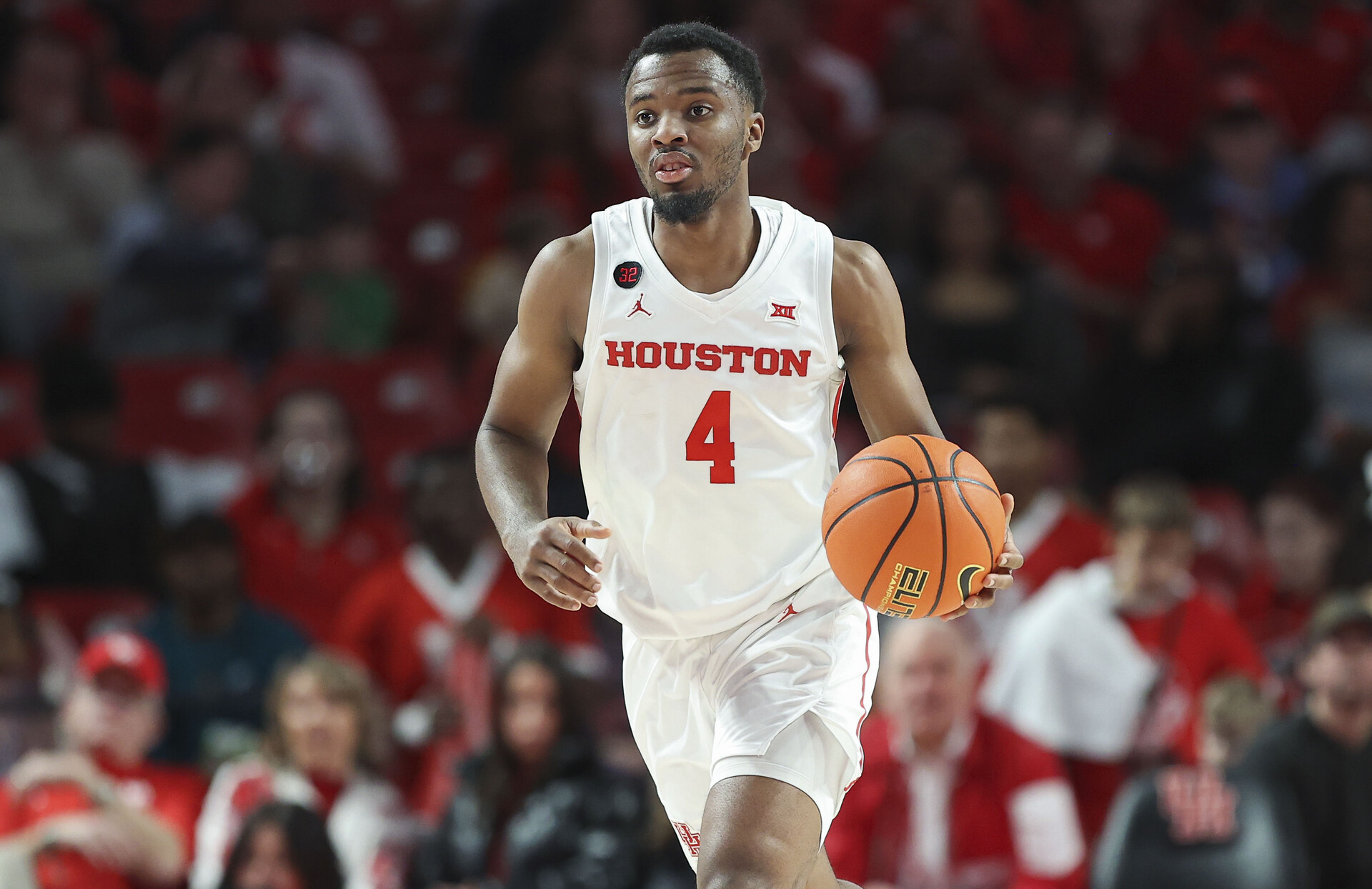 Houston Cougars guard L.J. Cryer (4) brings the ball up the court during the first half against the UCF Knights at Fertitta Center.