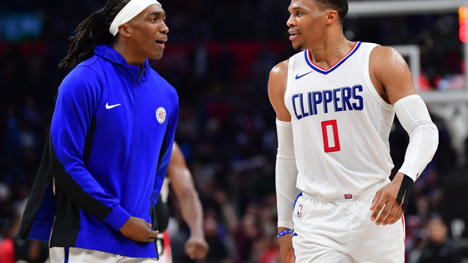 Los Angeles Clippers guard Russell Westbrook (0) and guard Terance Mann (14) react after forward Kawhi Leonard (2) scores three point basket against the Brooklyn Nets during the second half at Crypto.com Arena.