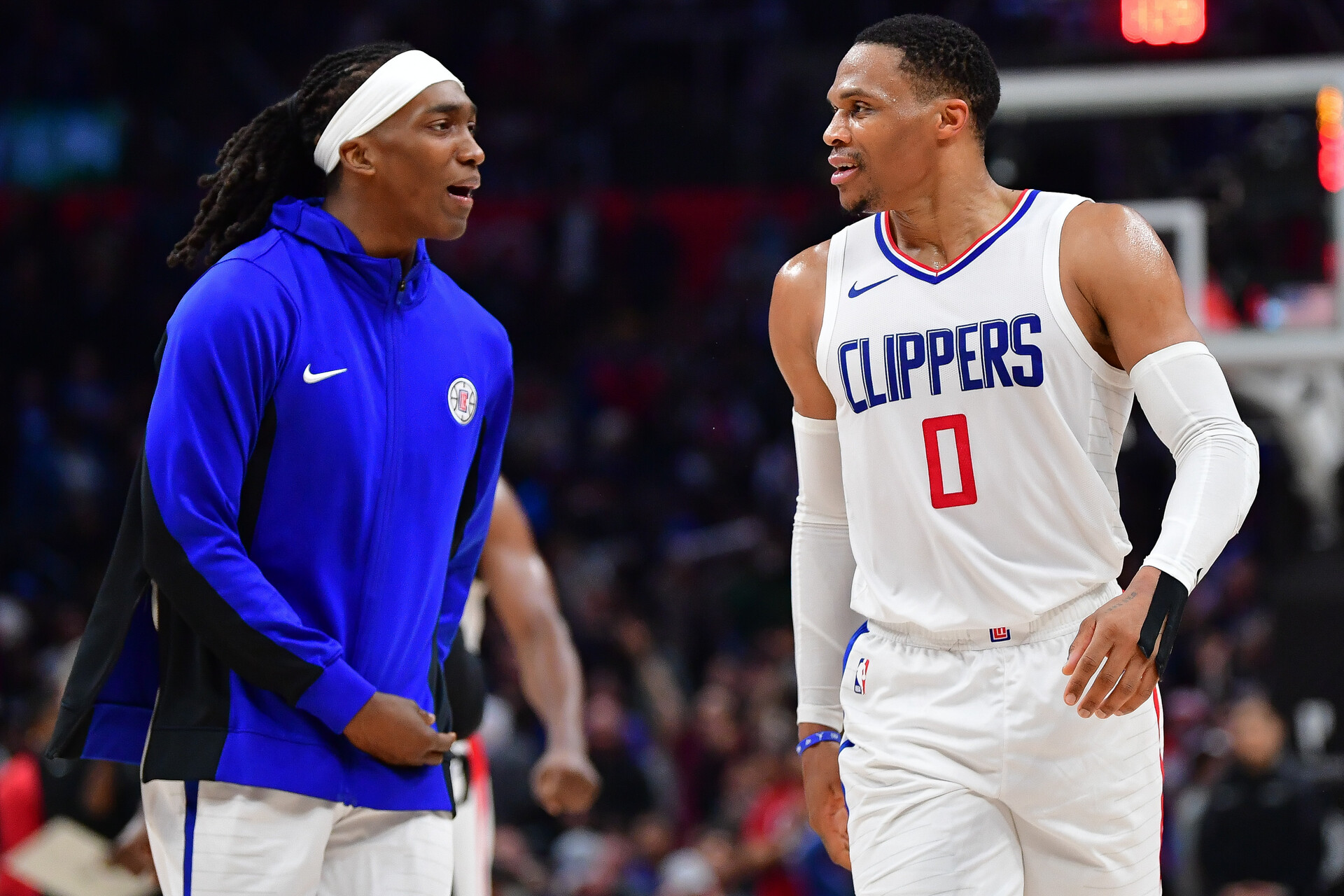 Los Angeles Clippers guard Russell Westbrook (0) and guard Terance Mann (14) react after forward Kawhi Leonard (2) scores three point basket against the Brooklyn Nets during the second half at Crypto.com Arena.