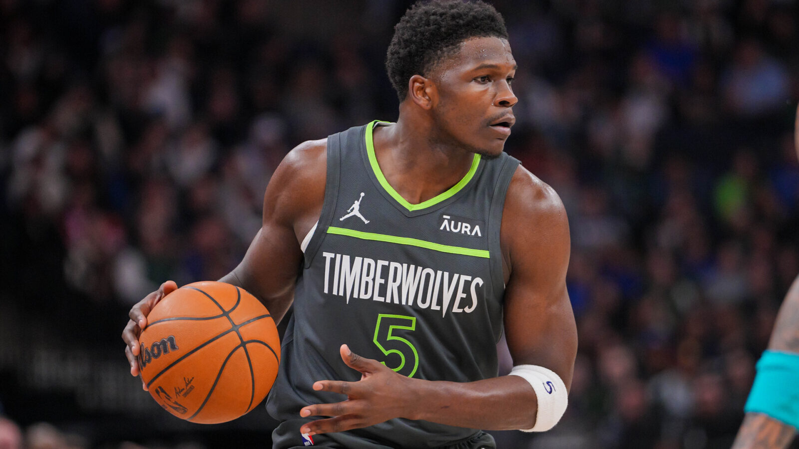Minnesota Timberwolves guard Anthony Edwards (5) dribbles against the Charlotte Hornets in the first quarter at Target Center.