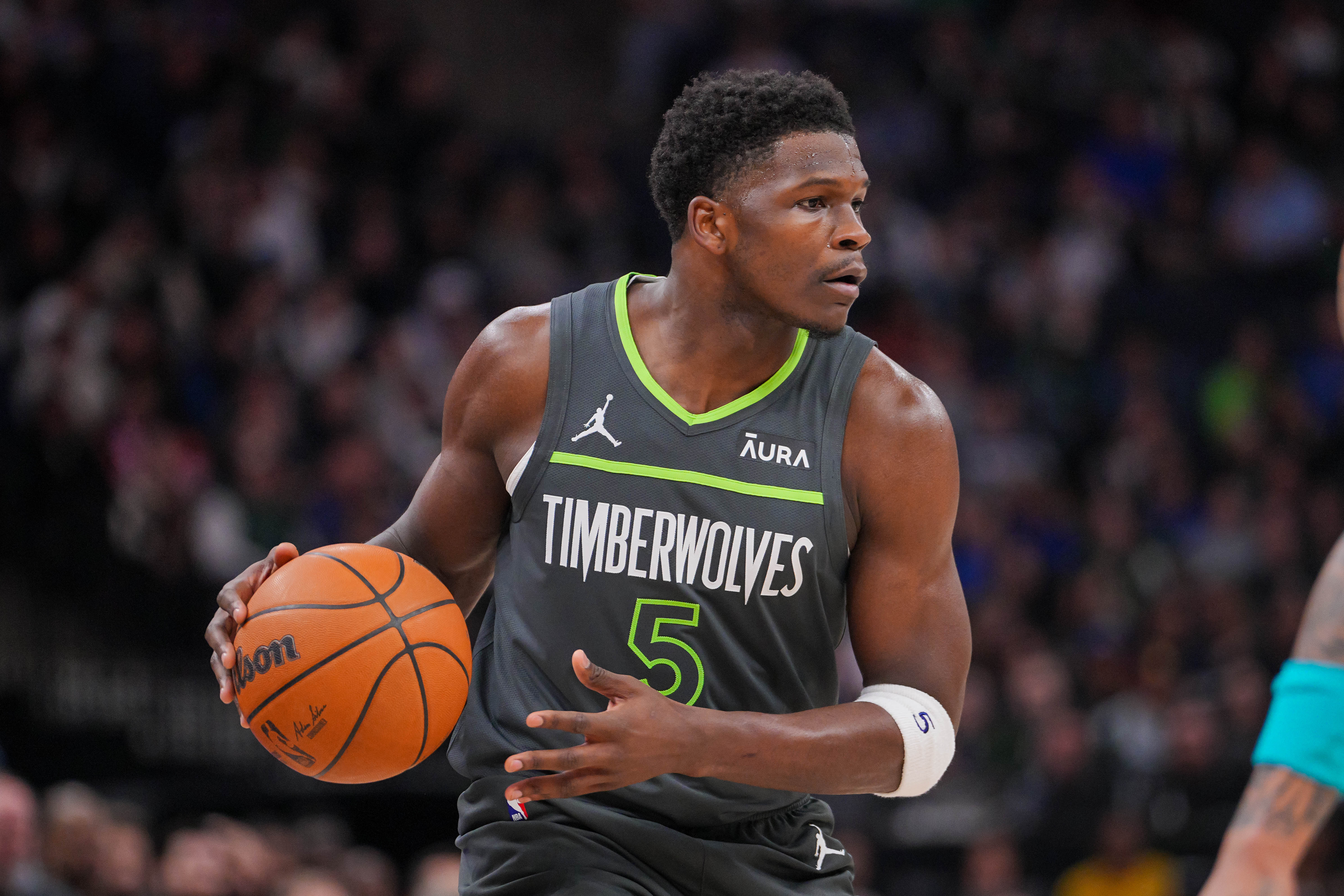 Minnesota Timberwolves guard Anthony Edwards (5) dribbles against the Charlotte Hornets in the first quarter at Target Center.