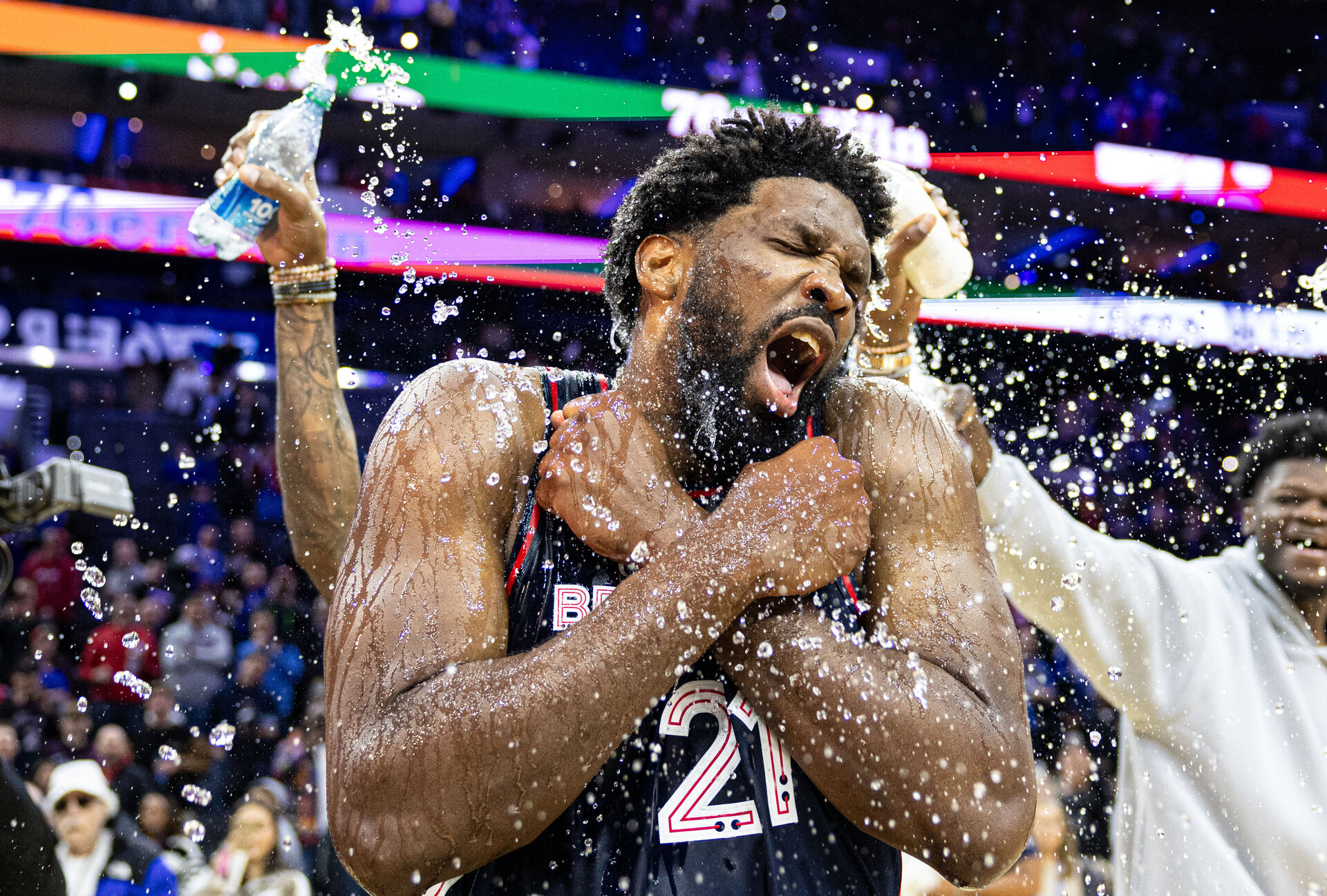 Philadelphia 76ers center Joel Embiid (21) is doused with water by teammates after scoring 70 points in a victory against the San Antonio Spurs at Wells Fargo Center.