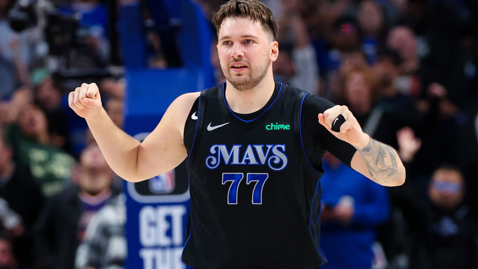 Dallas Mavericks guard Luka Doncic (77) reacts during the first half against the Phoenix Suns at American Airlines Center.
