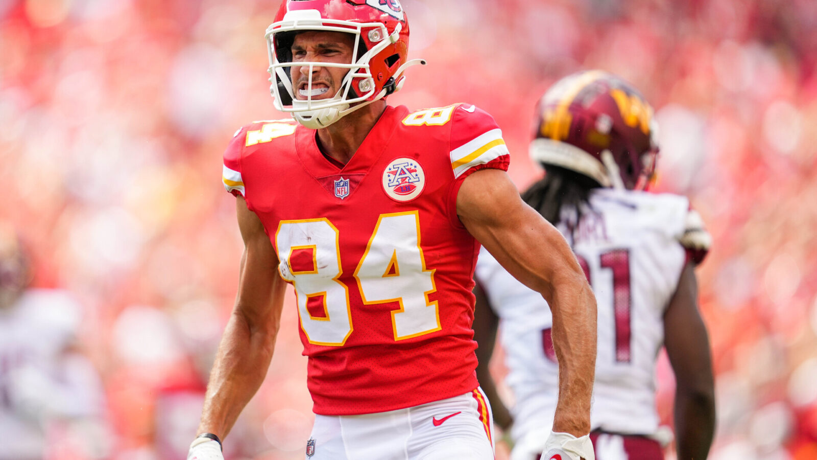 Kansas City Chiefs wide receiver Justin Watson (84) celebrates after catching a pass against the Washington Commanders during the first half at GEHA Field at Arrowhead Stadium.