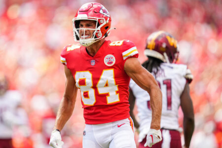 Kansas City Chiefs wide receiver Justin Watson (84) celebrates after catching a pass against the Washington Commanders during the first half at GEHA Field at Arrowhead Stadium.