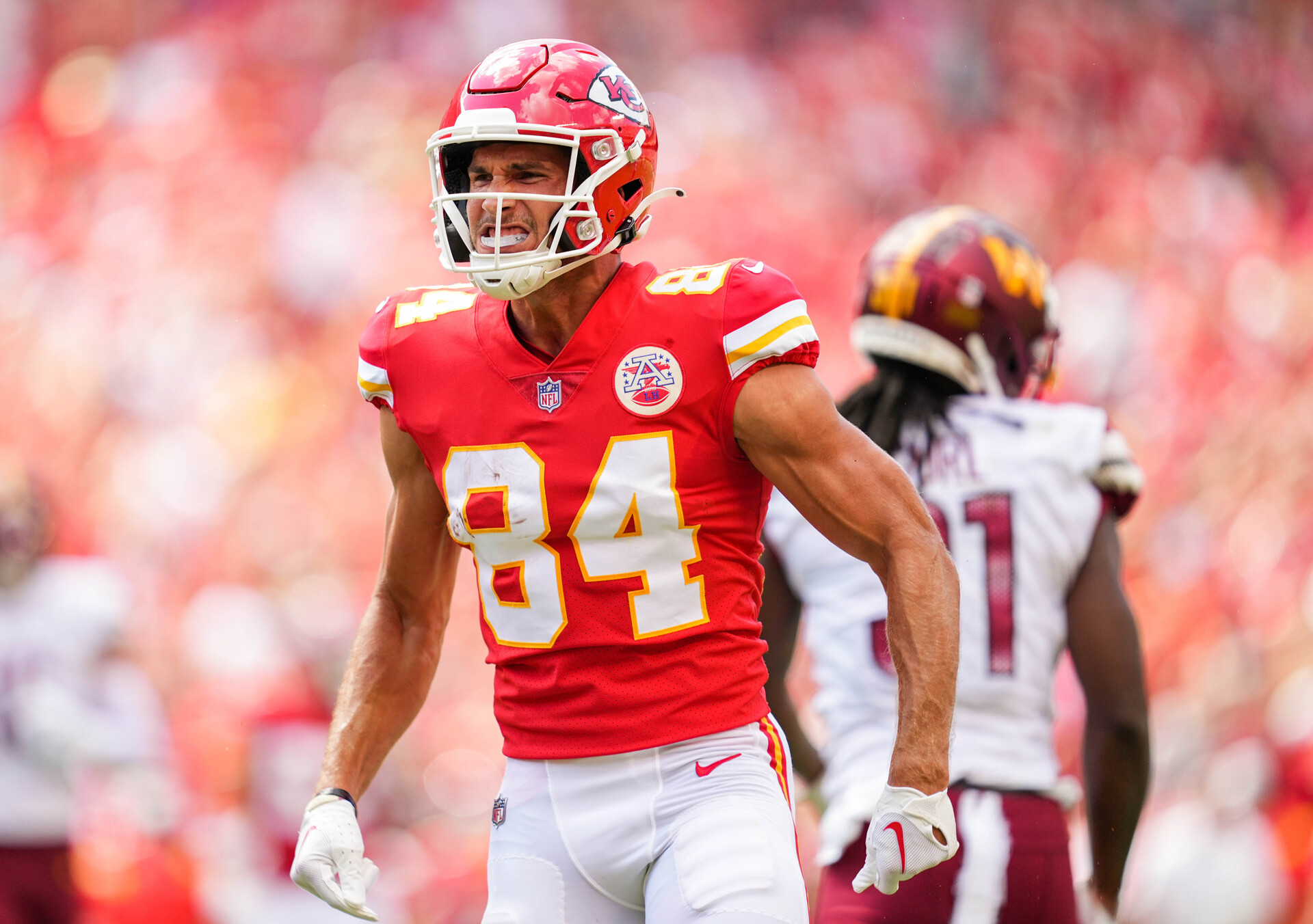 Kansas City Chiefs wide receiver Justin Watson (84) celebrates after catching a pass against the Washington Commanders during the first half at GEHA Field at Arrowhead Stadium.