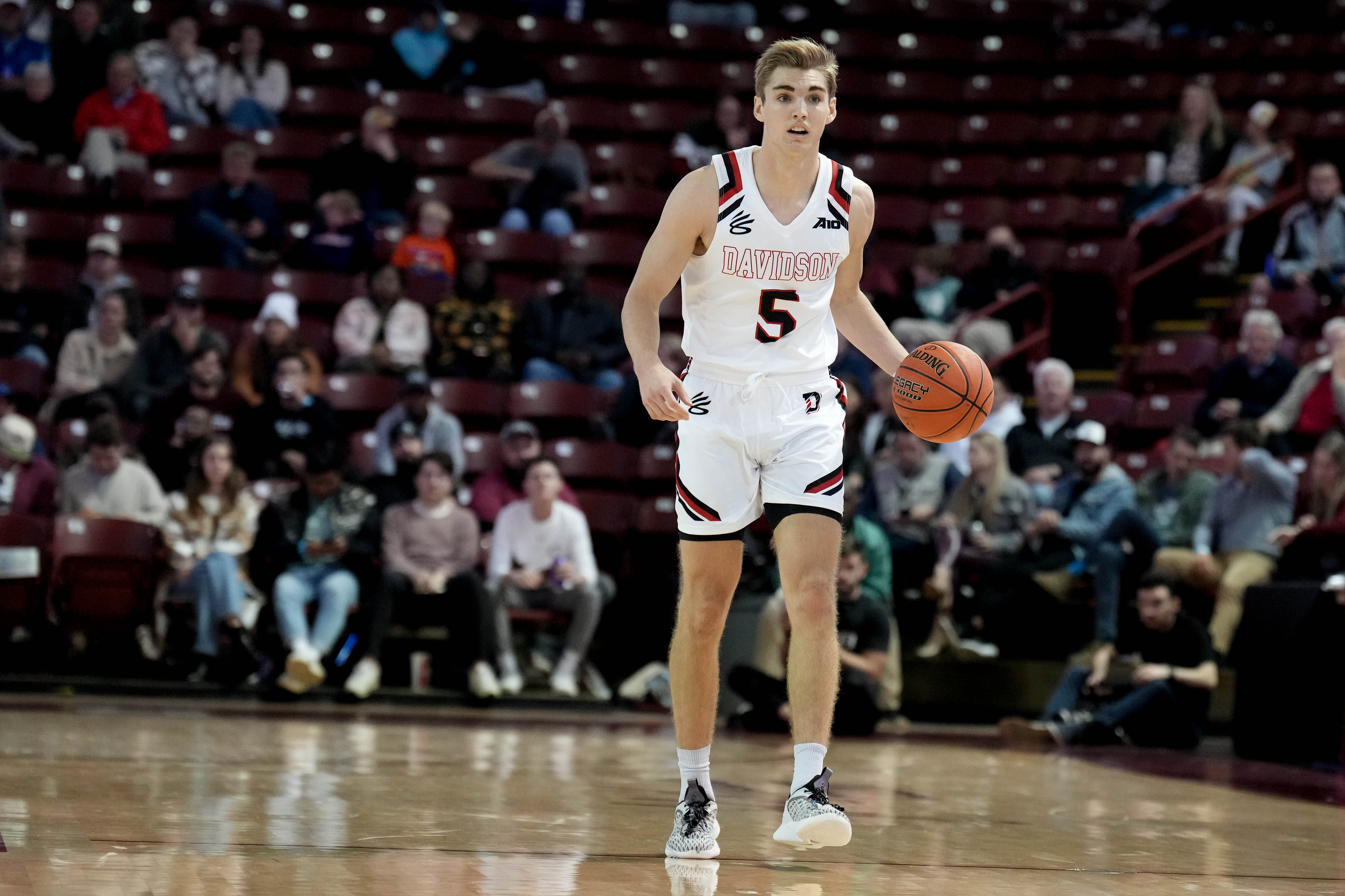 Nov 18, 2022; Charleston, South Carolina, USA; Davidson Wildcats guard Grant Huffman (5) brings the ball up court in the first half against the South Carolina Gamecocks at TD Arena.