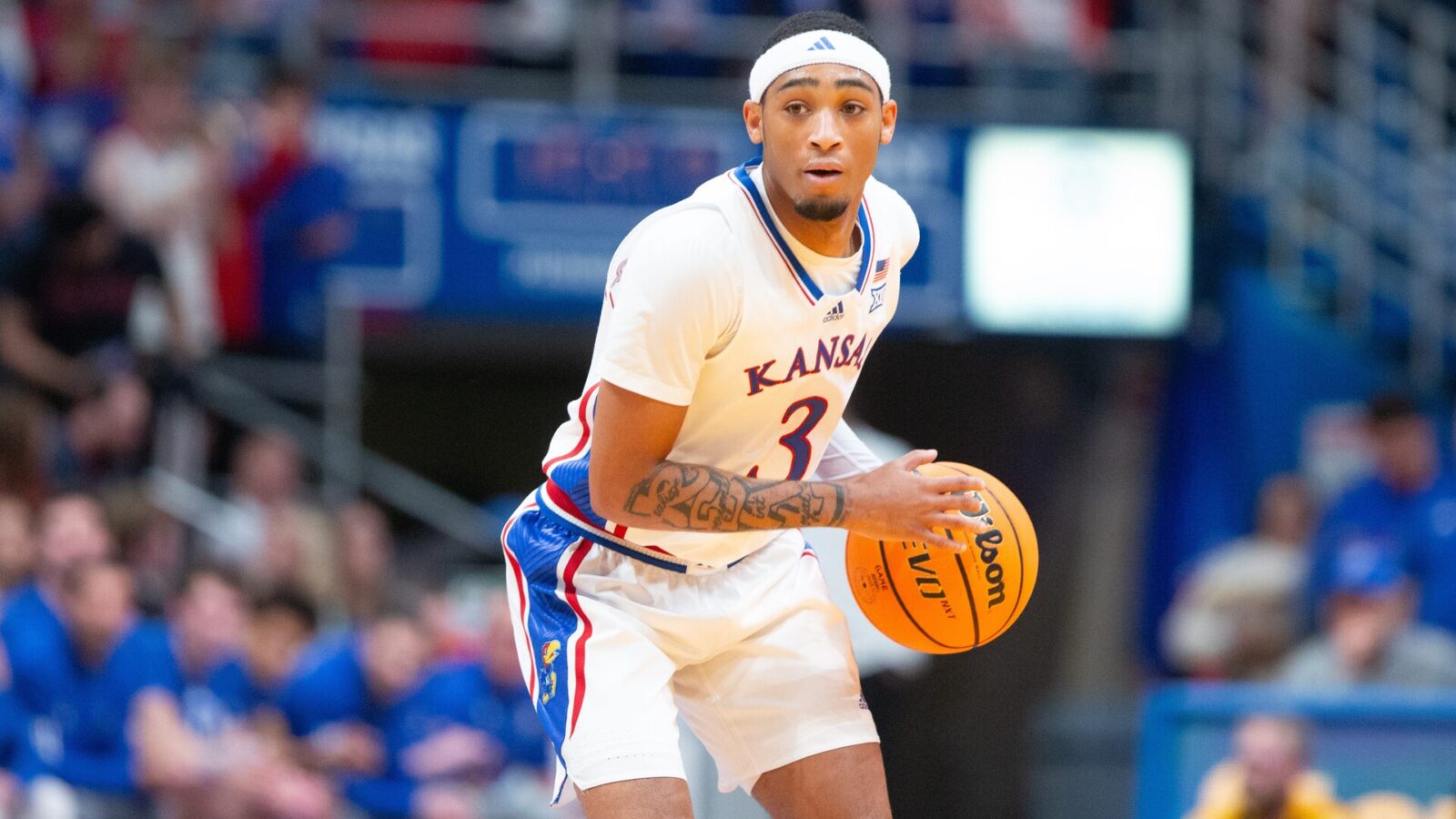 Kansas redshirt junior guard Dajuan Harris Jr. (3) dribbles down court during the first half of Wednesday's exhibition game against Fort Hays State inside Allen Fieldhouse.