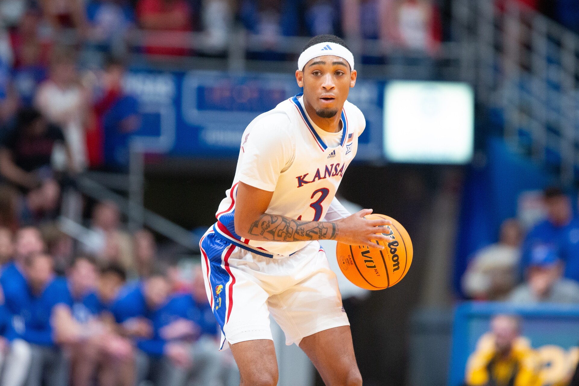 Kansas redshirt junior guard Dajuan Harris Jr. (3) dribbles down court during the first half of Wednesday's exhibition game against Fort Hays State inside Allen Fieldhouse.