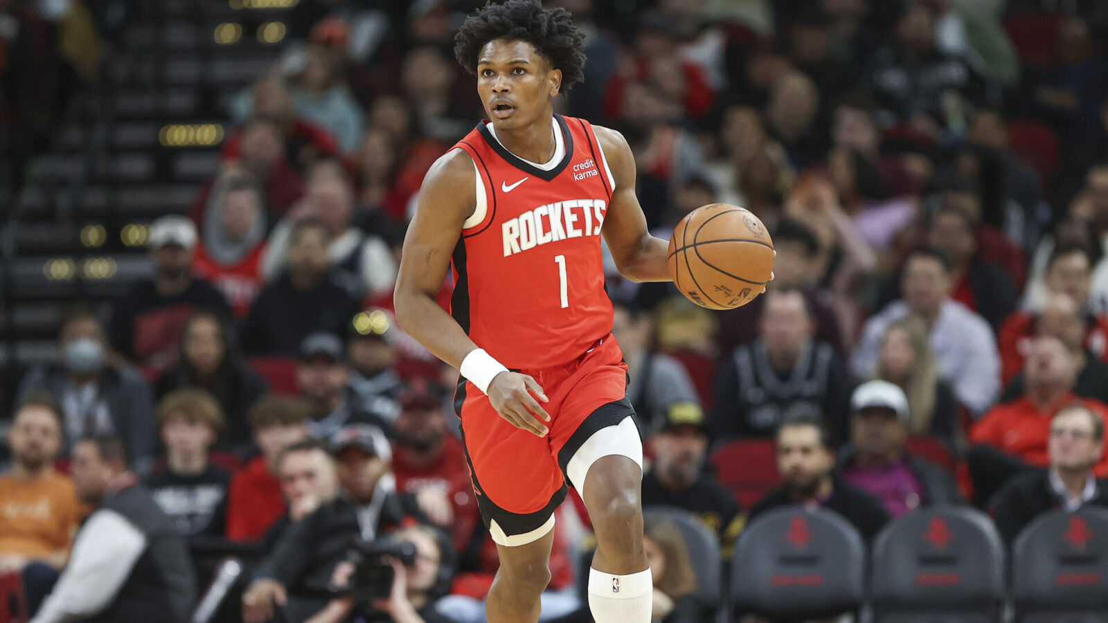 Houston Rockets forward Amen Thompson (1) brings the ball up the court during the second quarter against the San Antonio Spurs at Toyota Center.