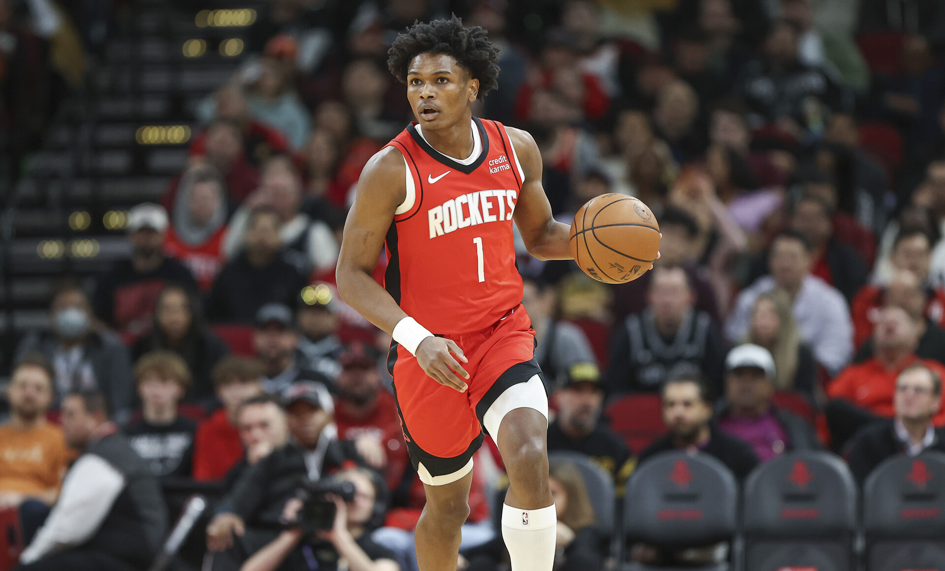 Houston Rockets forward Amen Thompson (1) brings the ball up the court during the second quarter against the San Antonio Spurs at Toyota Center.