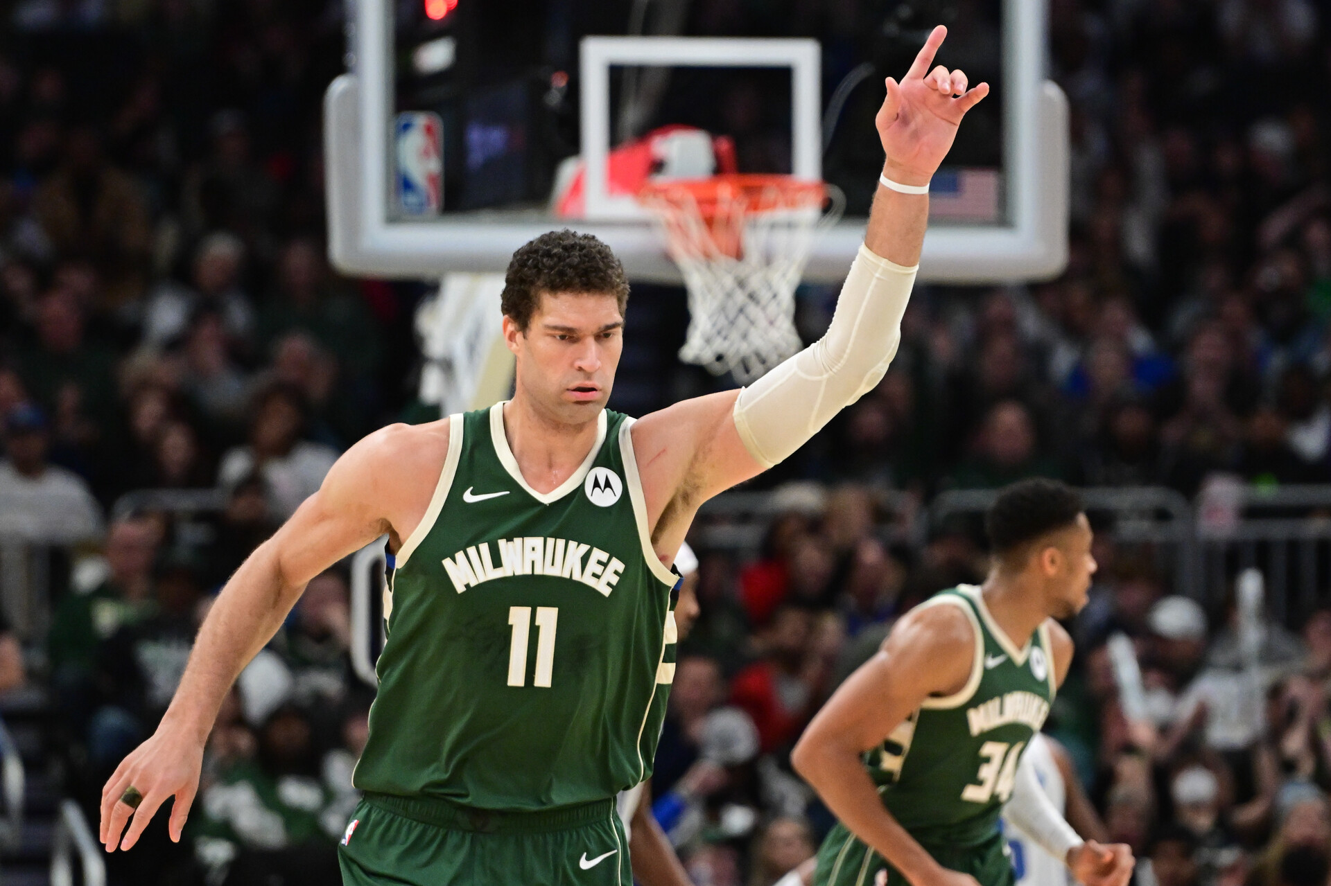 Milwaukee Bucks center Brook Lopez (11) reacts after scoring a basket the third quarter against the Orlando Magic at Fiserv Forum.