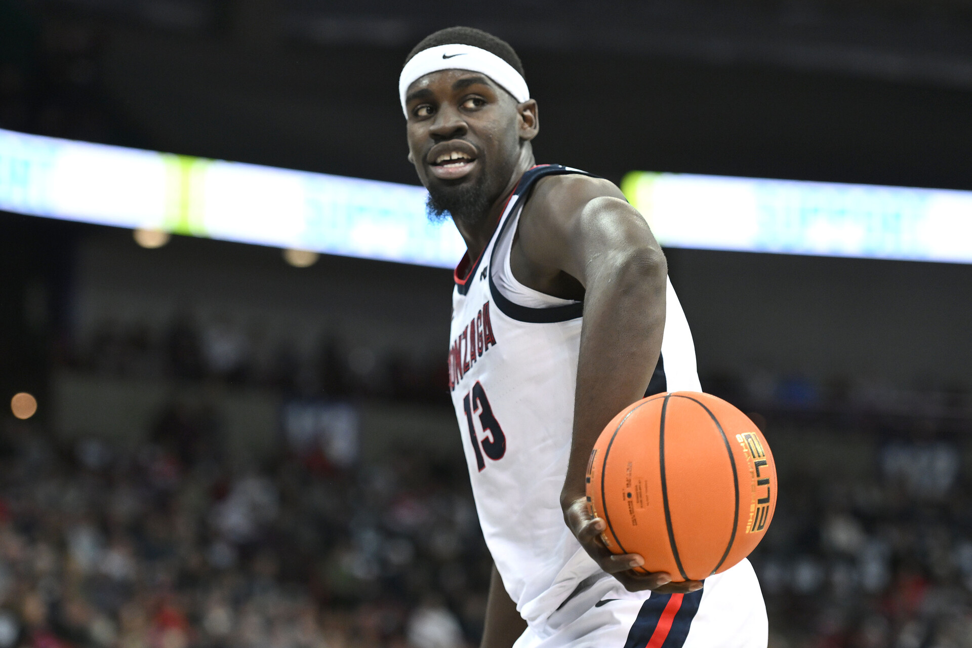 Jan 4, 2024; Spokane, Washington, USA; Gonzaga Bulldogs forward Graham Ike (13) flips the ball to an official during a game against the Pepperdine Waves in the first half at Spokane Arena.